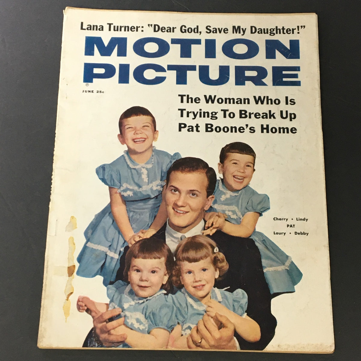Cover of VTG Motion Picture Magazine June 1960 featuring a smiling man with children in blue dresses, highlighting the theme of family and Hollywood charm.