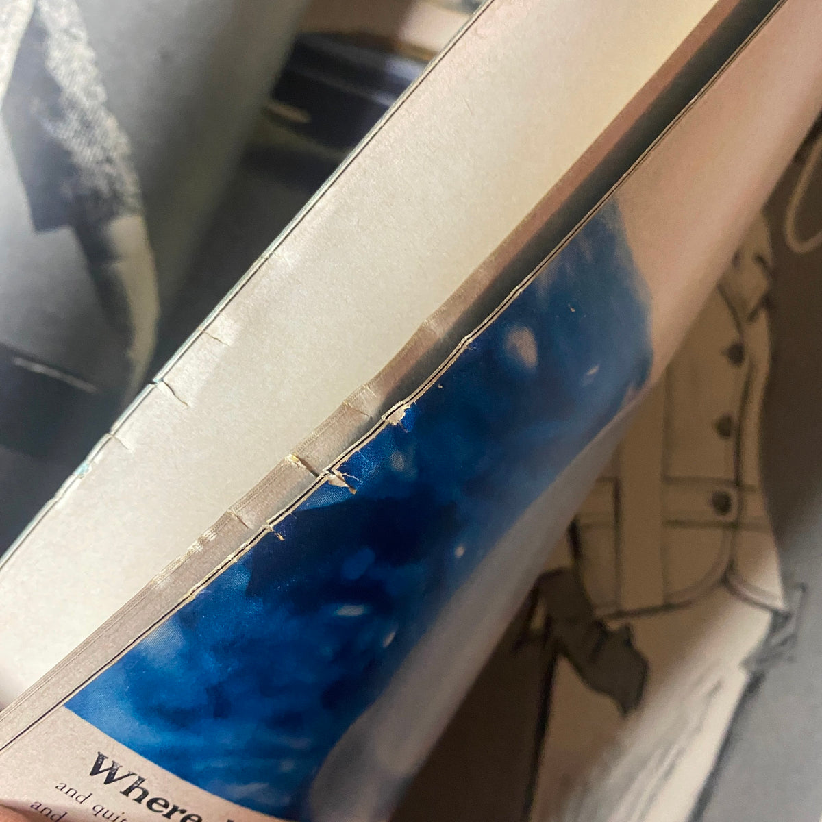 Close-up detail of the inside edge of Vogue Magazine February 1, 1962, highlighting the condition and age of the paper, emphasizing the collectible nature of this fashion magazine.