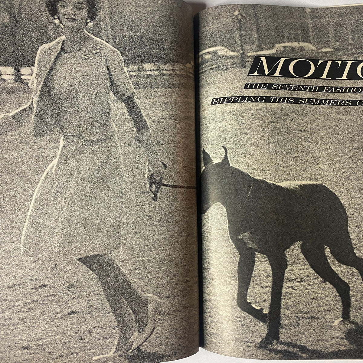 Photograph of a woman walking a large dog featured in Vogue Magazine May 1961, highlighting the interplay of fashion and lifestyle.