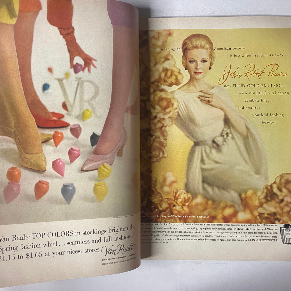 Advertisement page from Vogue Magazine February 15, 1961 promoting Van Raalté stockings with a model showcasing vibrant colors and a beauty product by John Robert Powers.