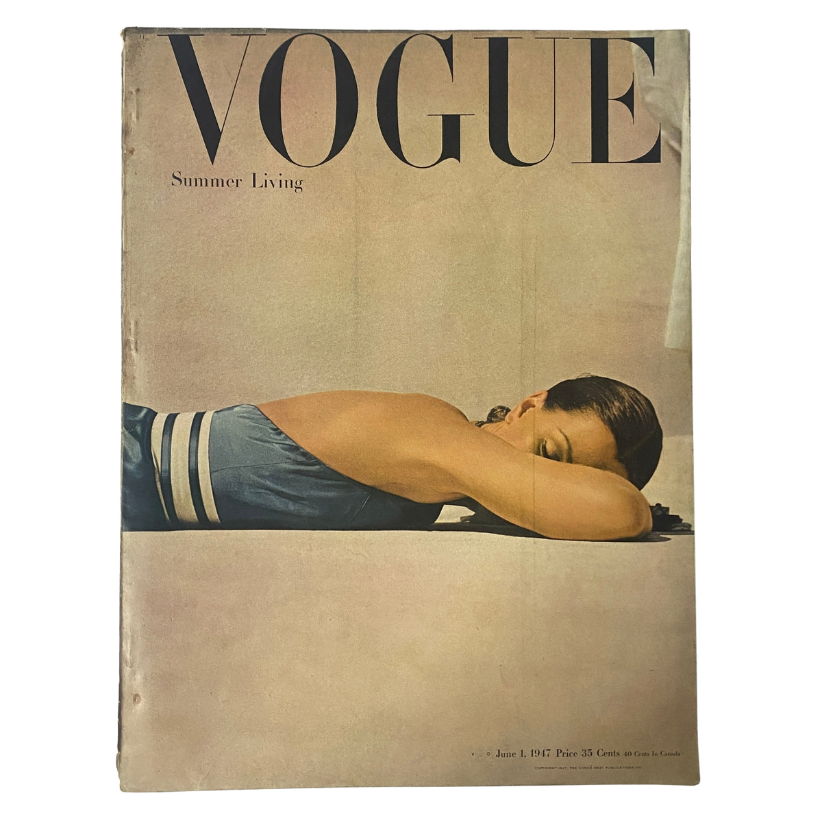 Vogue Magazine June 1, 1947 cover featuring a model in a summer dress, showcasing the theme of Summer Living, photographed by John Rawlings.
