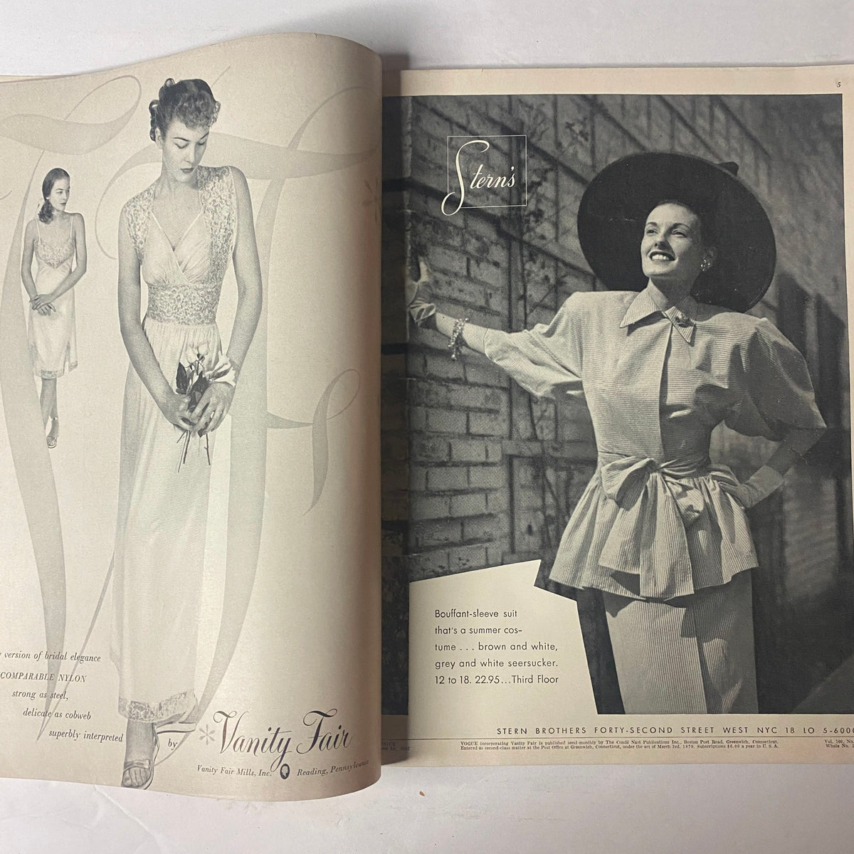 Vogue Magazine June 1, 1947 Kay Hernan Cover by John Rawlings displaying a stylish model in a classic attire from Stem Brothers, embodying postwar elegance and sophistication.