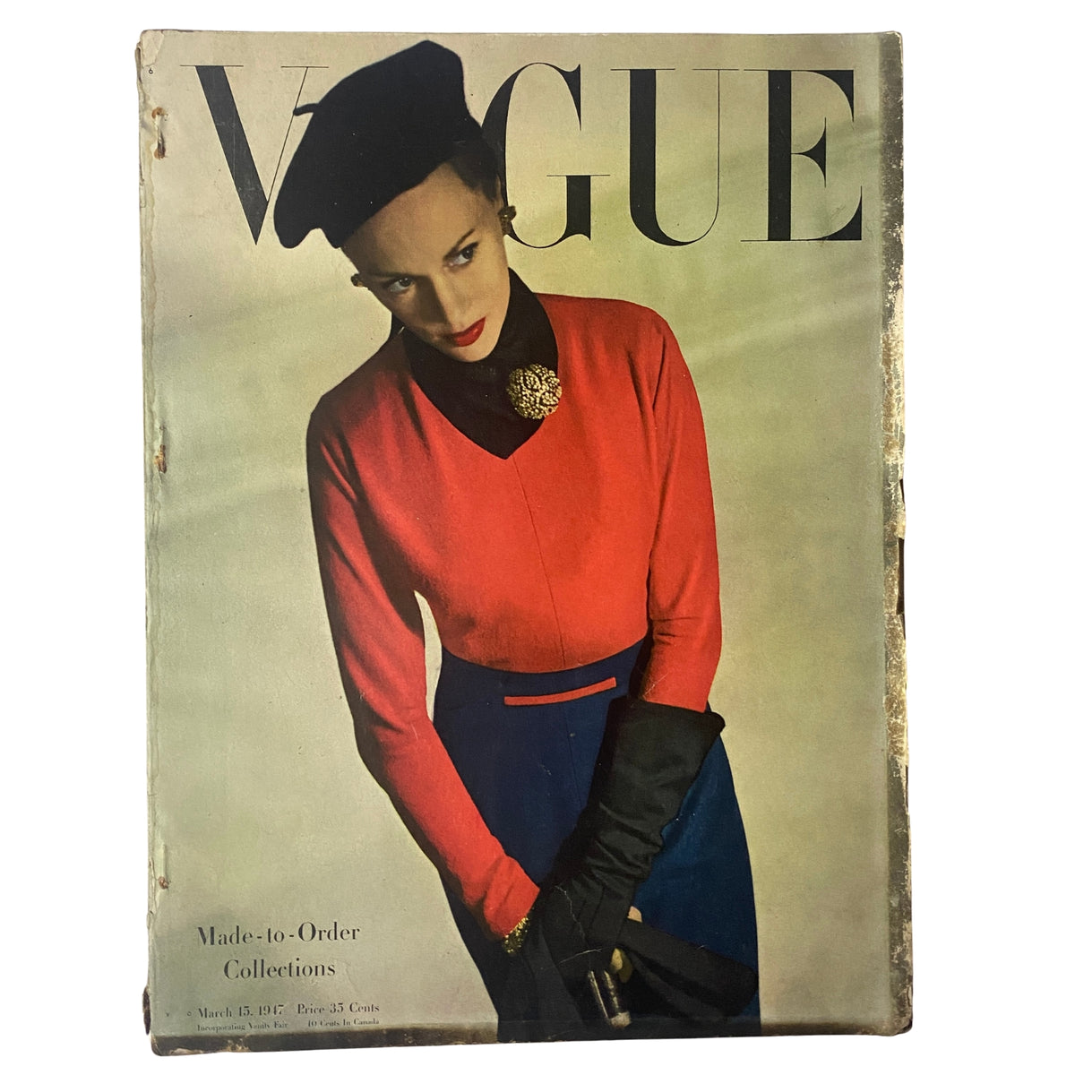 Cover of Vogue Magazine March 15, 1947 featuring model Meg Mundy, photographed by Horst P. Horst, showcasing a vintage fashion design with a red and blue outfit and elegant accessories.