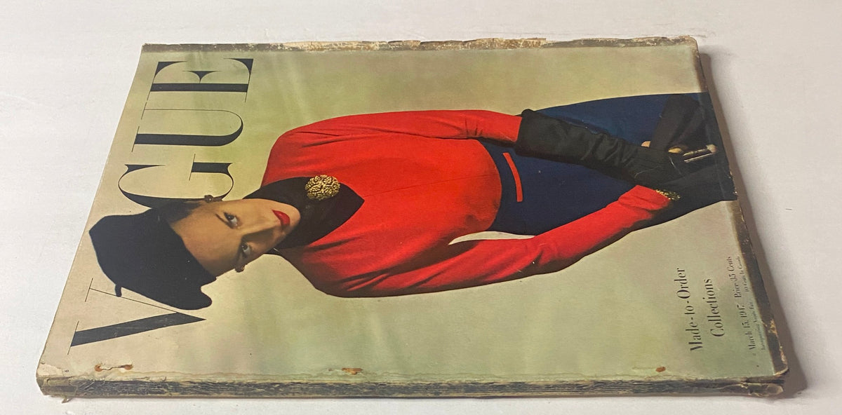 Vogue Magazine March 15, 1947 cover featuring Meg Mundy, captured by Horst P. Horst, displaying a stylish vintage look with a dramatic expression and sophisticated attire.