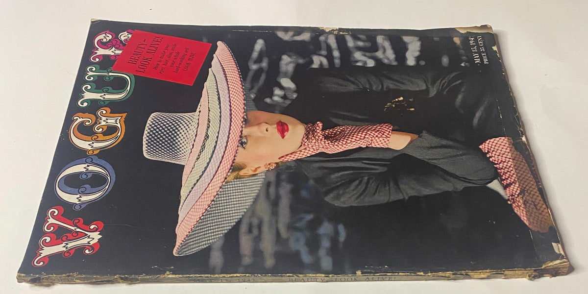 Another view of the Vogue Magazine May 15, 1942 cover showing Maureen Zollman in a chic hat and scarf, illustrated by John Rawlings.