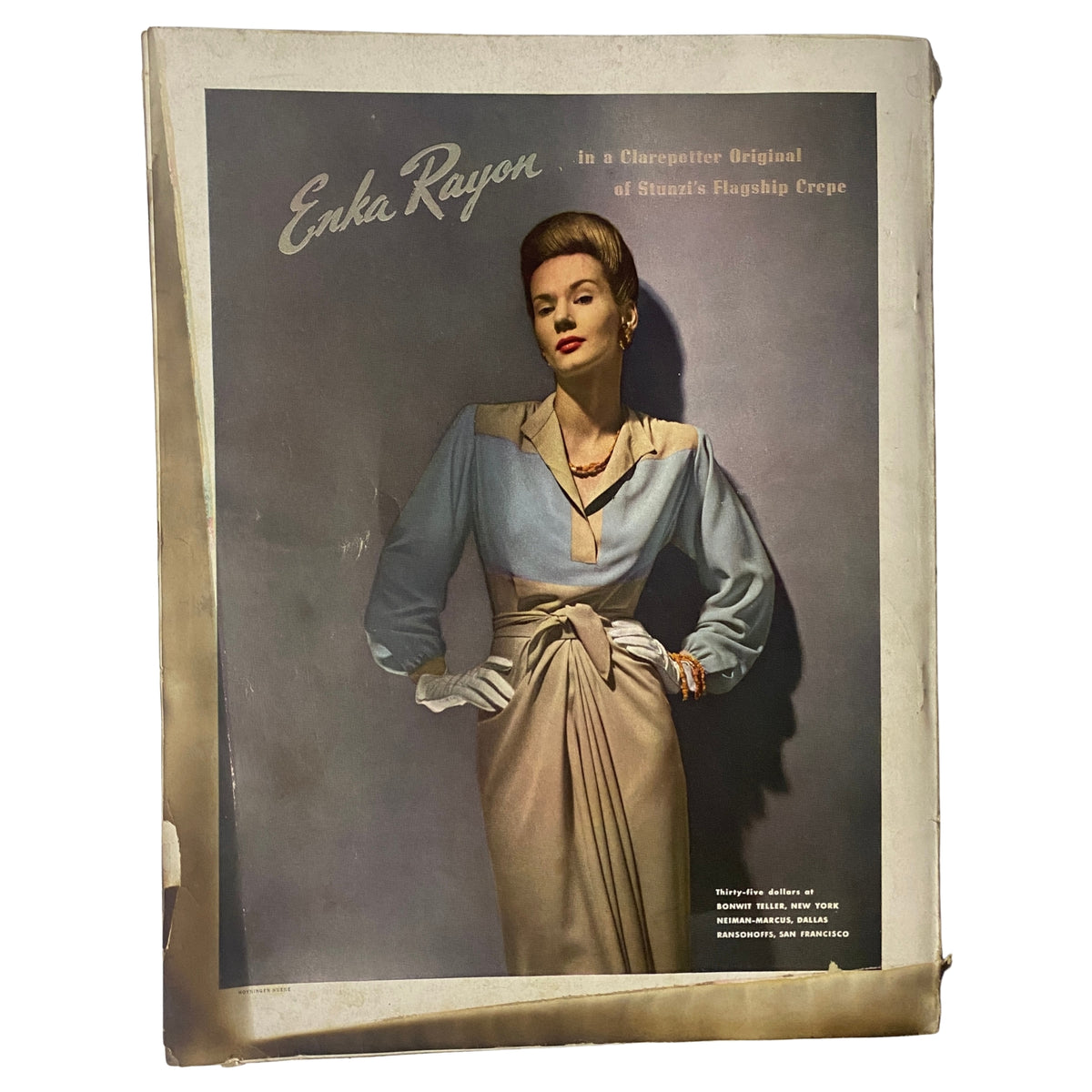 Cover of Vogue Magazine May 15, 1942 featuring Enka Rayon advertisement with a stylish woman in a vintage outfit, emphasizing the magazine's focus on fashion and textiles from the era.