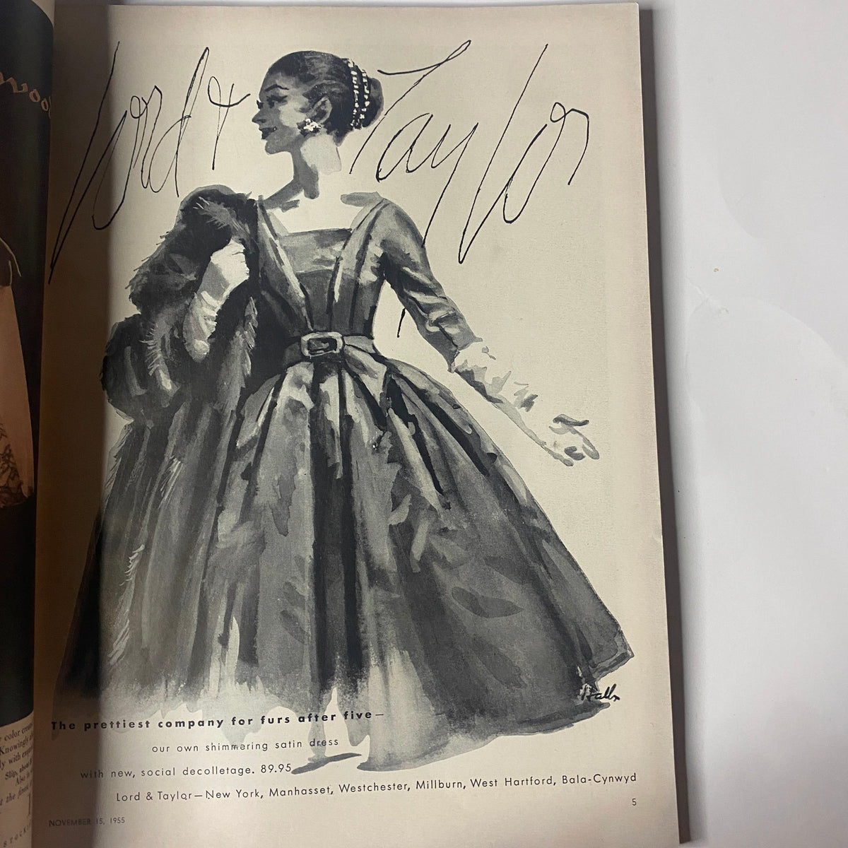 Artistic advertisement page from Vogue Magazine November 15, 1955 for Lord & Taylor, showcasing a model in a fur and elegant dress illustration.