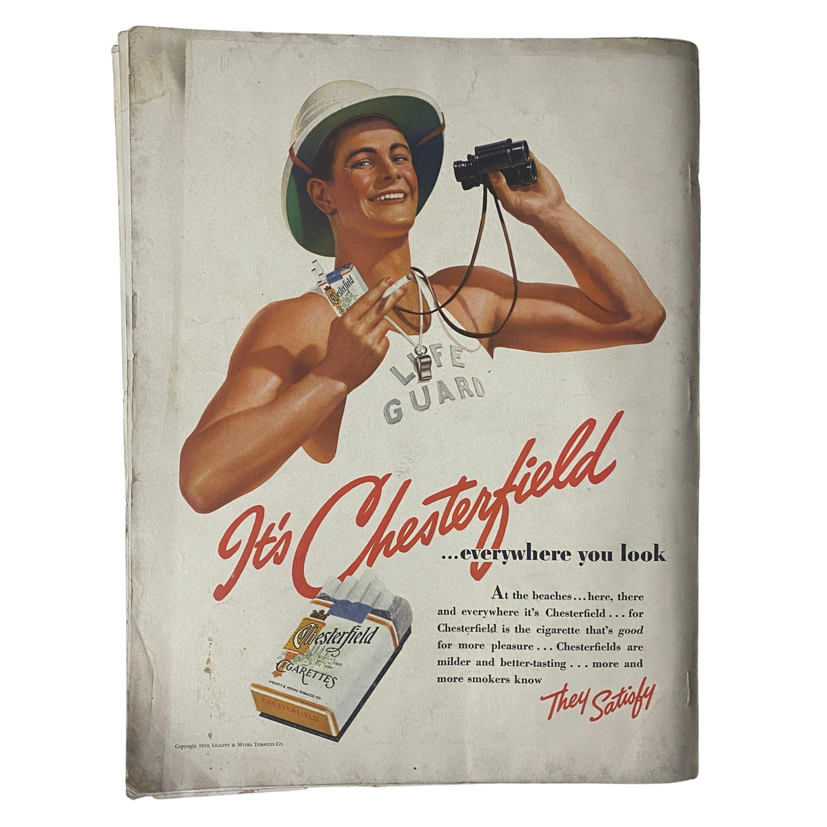 Back cover of Vogue Magazine July 15, 1939 Between-Seasons Fashions, featuring a colorful Chesterfield advertisement with a smiling lifeguard.