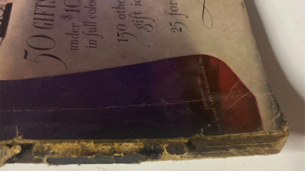 Back cover detail of Vogue Magazine December 1, 1941 with visible aging and slight damage, highlighting its historical value.