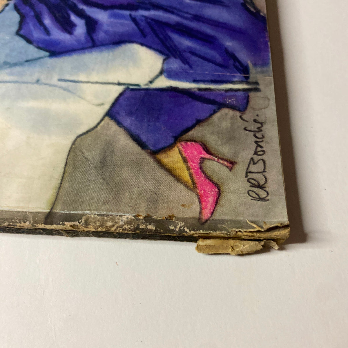 Close-up of the cover art from Vogue Magazine November 1, 1947, featuring a stylish purple dress and pink shoe illustration by René Bouché.