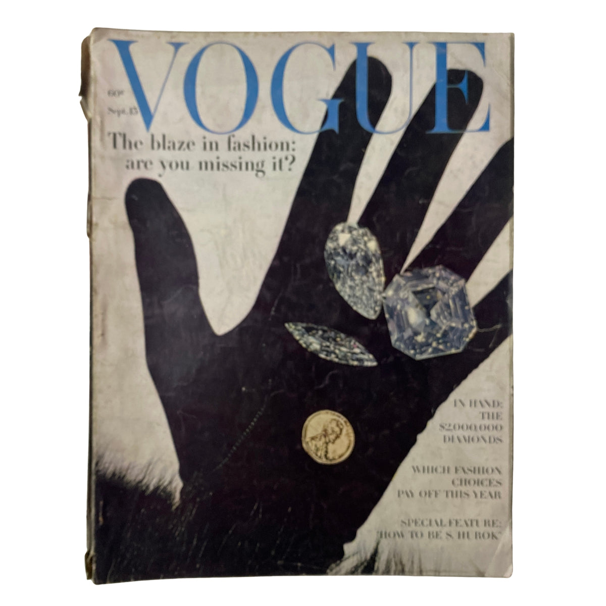 Cover of Vogue Magazine September 15, 1962 featuring the title 'The Blaze in Fashion: Are You Missing It?' The cover displays a dramatic black hand silhouette adorned with diamonds and a coin, symbolizing luxury and style.