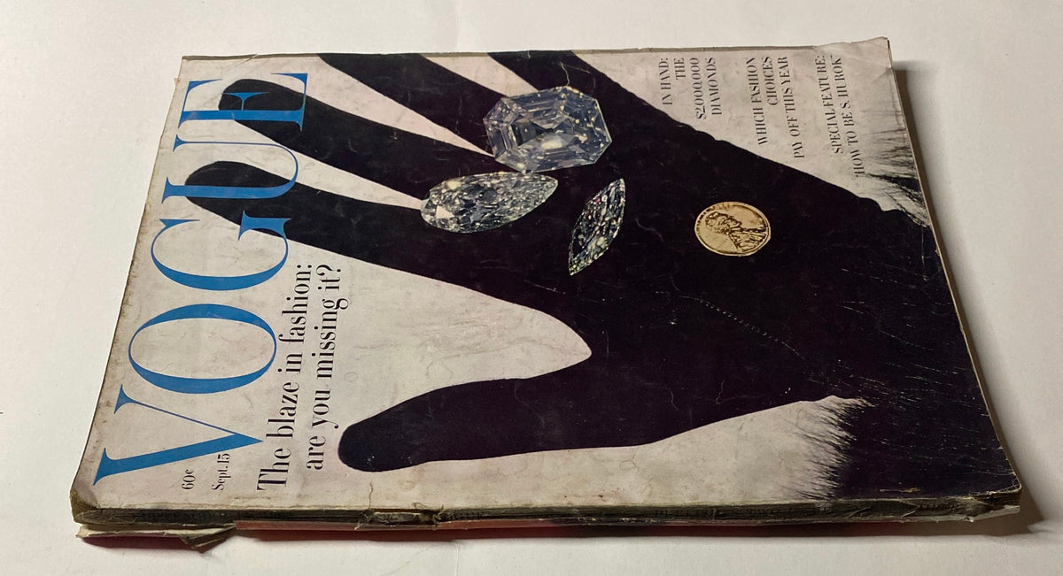 Vogue Magazine September 15, 1962 cover showcasing 'The Blaze in Fashion: Are You Missing It?' The cover features a striking black hand holding diamonds and a coin, exemplifying the bold fashion trends of the early 1960s.
