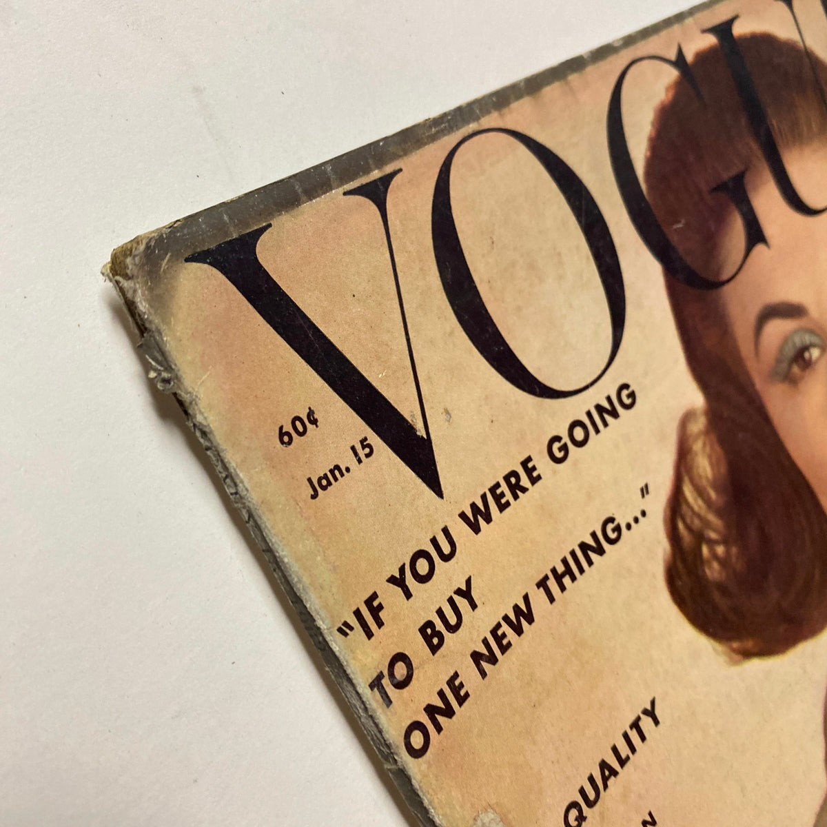 Detailed image of the corner of Vogue Magazine January 15, 1962, showing the title and quote 'If you were going to buy one new thing...', reflecting the magazine's mid-century design.