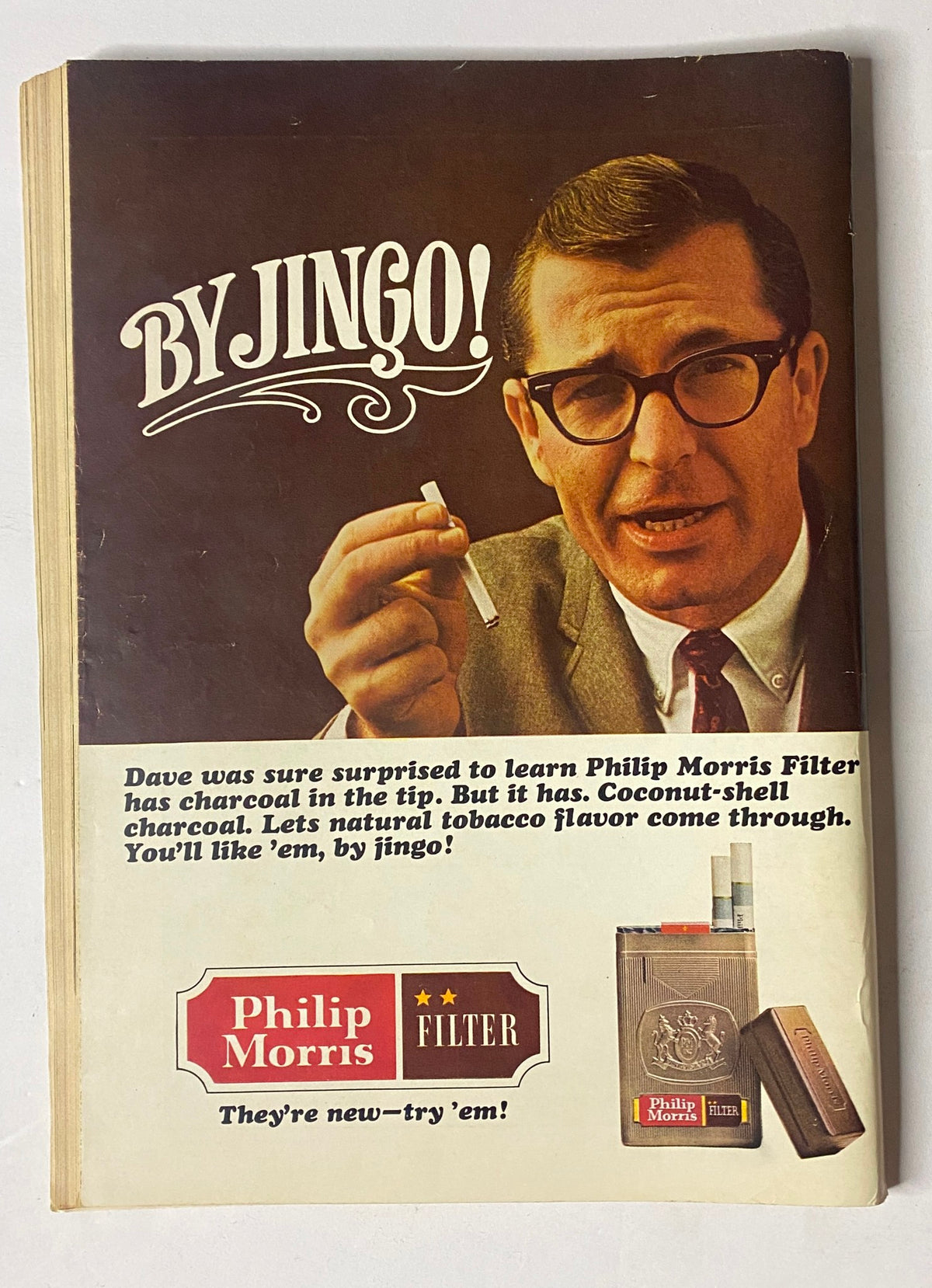Vintage advertisement from The New Yorker Full Magazine April 17, 1965 for Philip Morris Filter cigarettes featuring a man promoting the product with the tagline 'By Jingo!'.