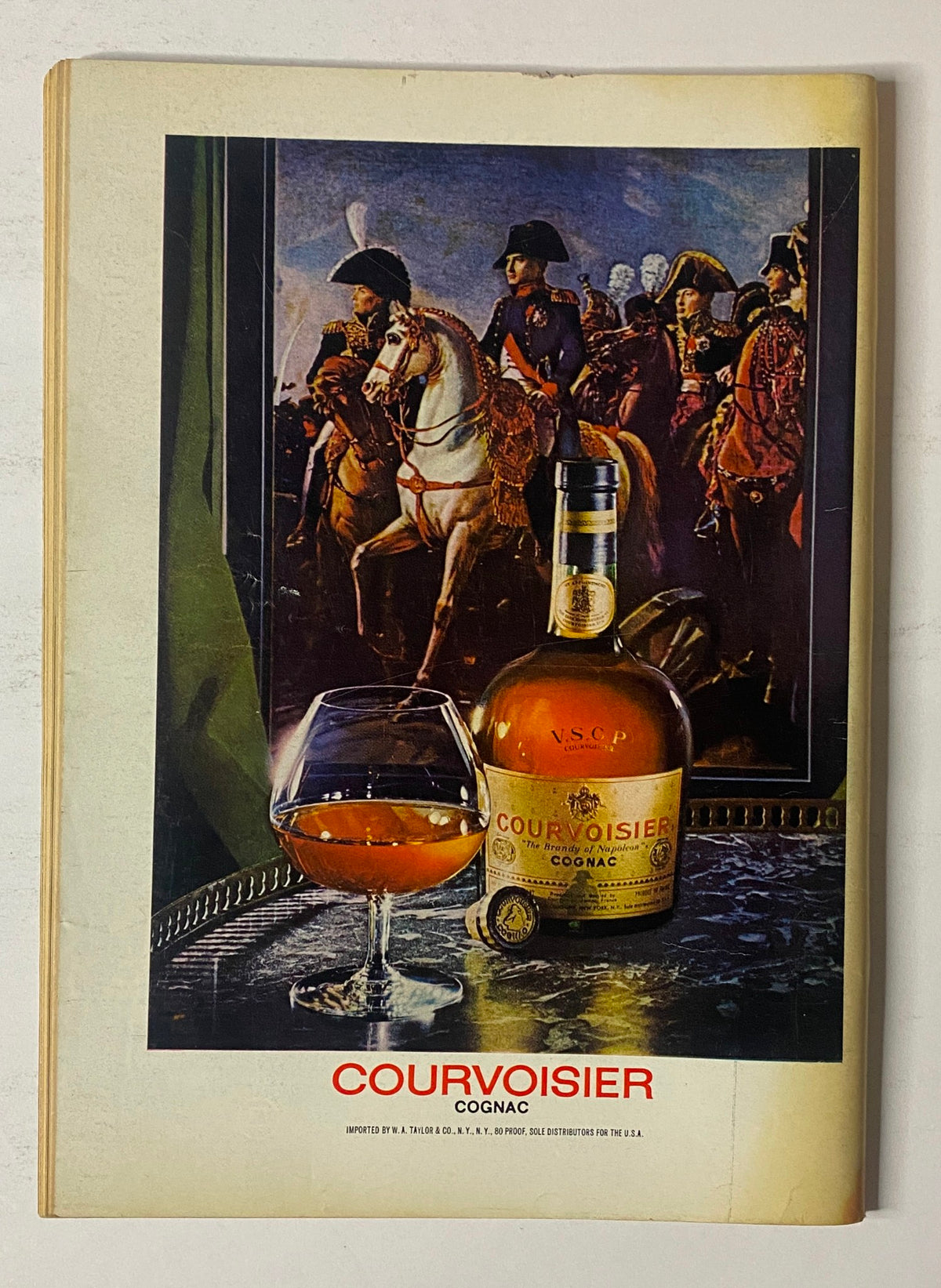 Courvoisier Cognac advertisement from The New Yorker Full Magazine April 15, 1974, showcasing a bottle and glass of cognac with a historical painting in the background.