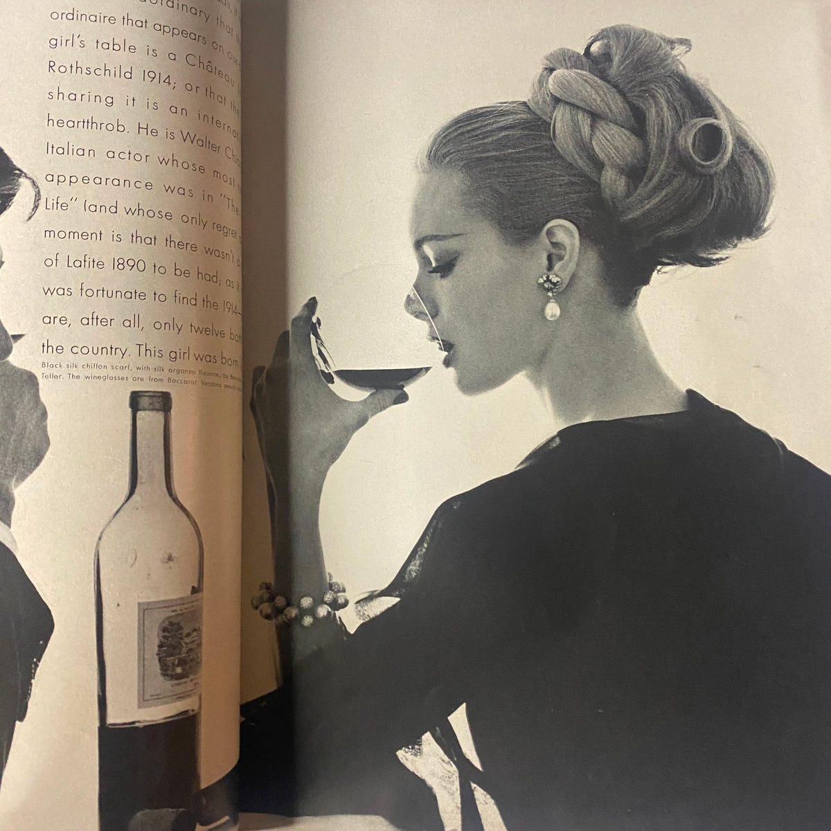 Black and white editorial image from Vogue Magazine April 15, 1962 depicting a model sipping wine, epitomizing 1960s elegance and fashion.