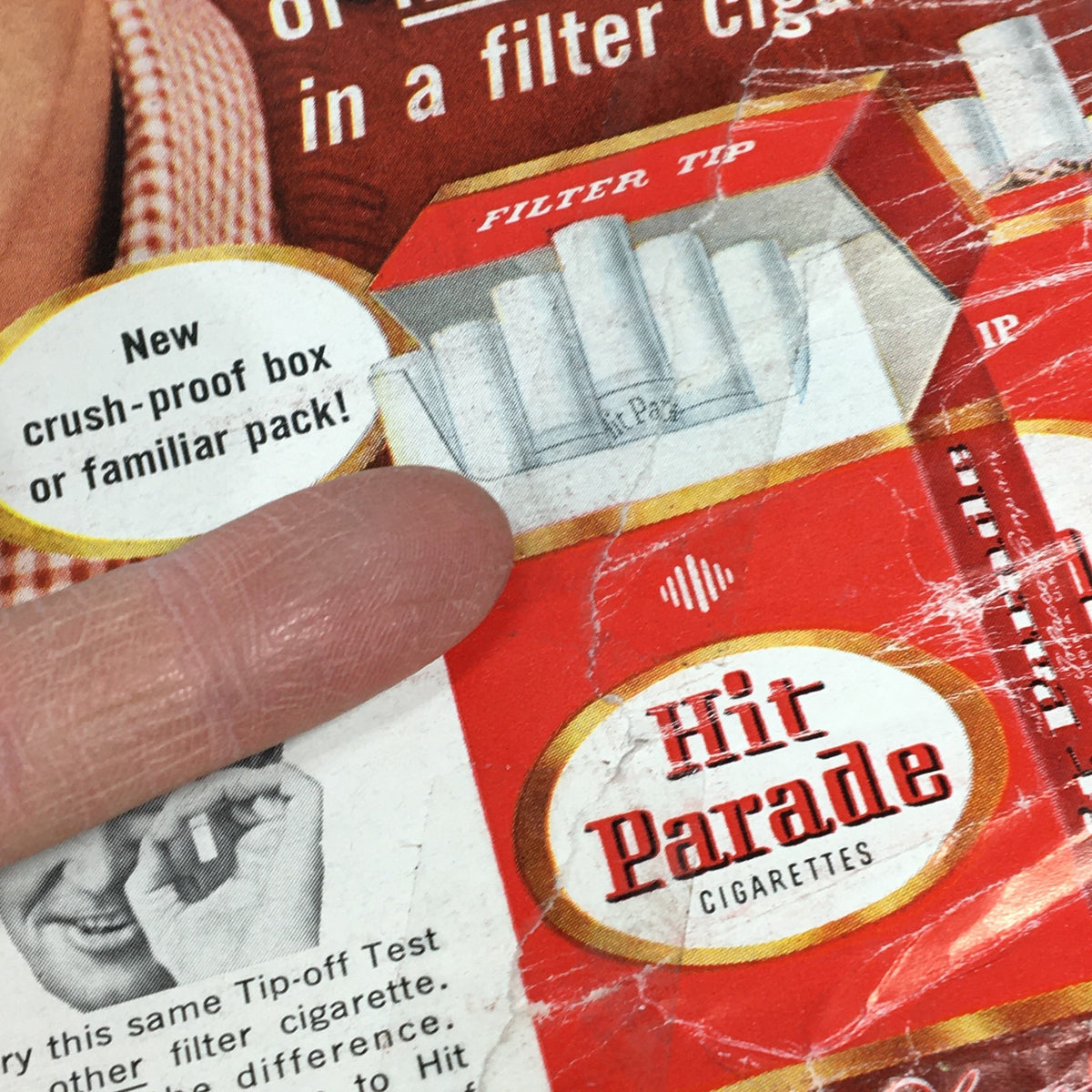 Detail of the back cover of VTG Newsweek Magazine September 23 1957, highlighting an advertisement for Hit Parade cigarettes with a finger pointing at the product.