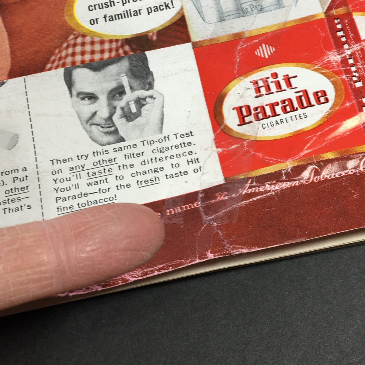 Detail from VTG Newsweek Magazine September 23 1957 showing an advertisement for Hit Parade Cigarettes featuring a man demonstrating a filter test, highlighting the fresh taste of fine tobacco.