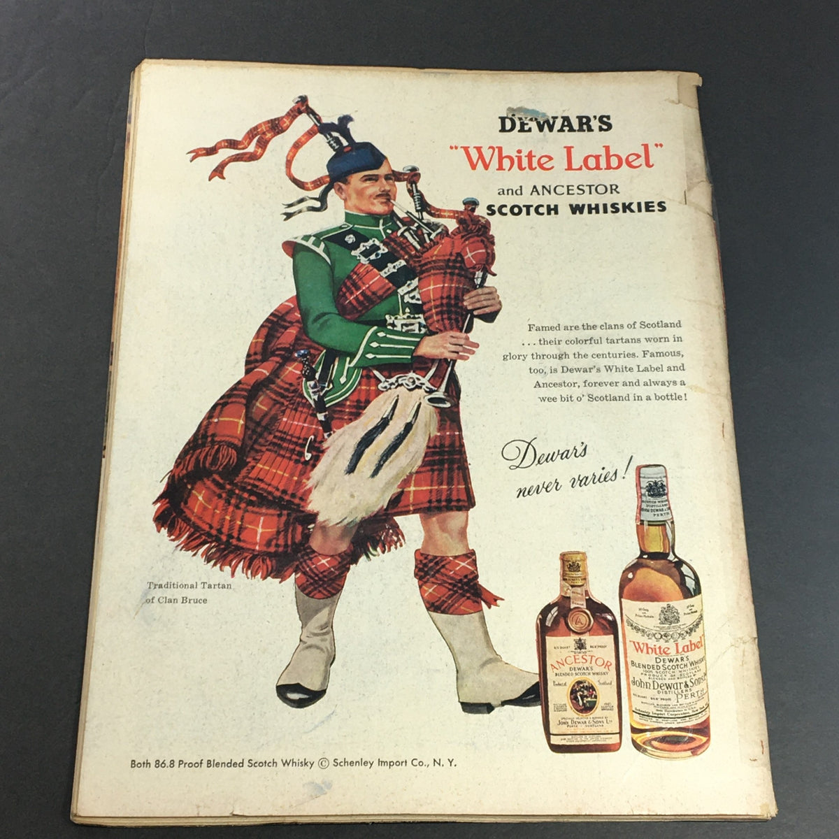 Back cover of VTG Newsweek Magazine December 23, 1957 showcasing an advertisement for Dewar's Scotch Whiskies, providing cultural context from the era.