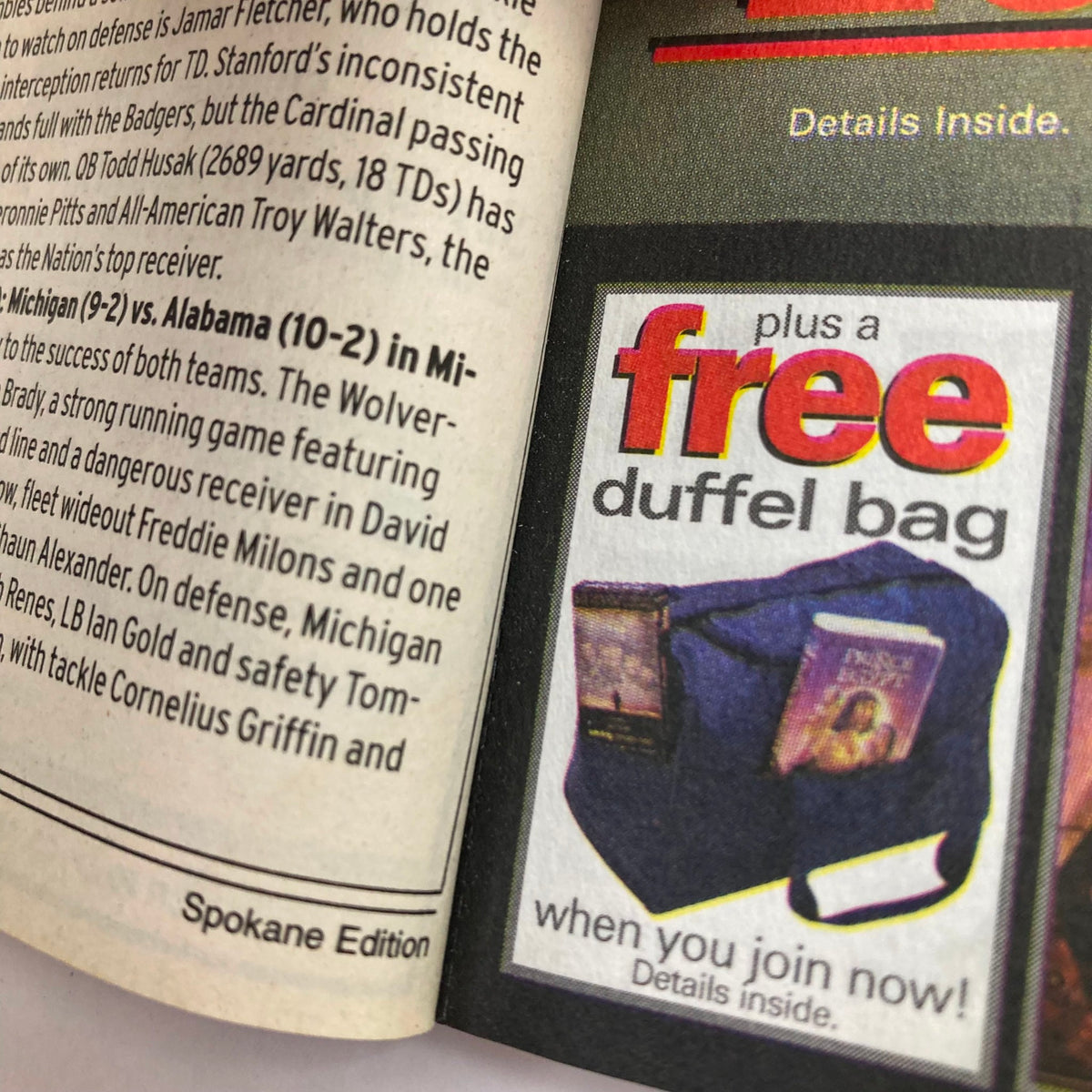Interior page of the TV Guide Magazine January 1, 2000 showing an advertisement for a free duffel bag offer. The Spokane Edition includes details about promotions alongside program listings.