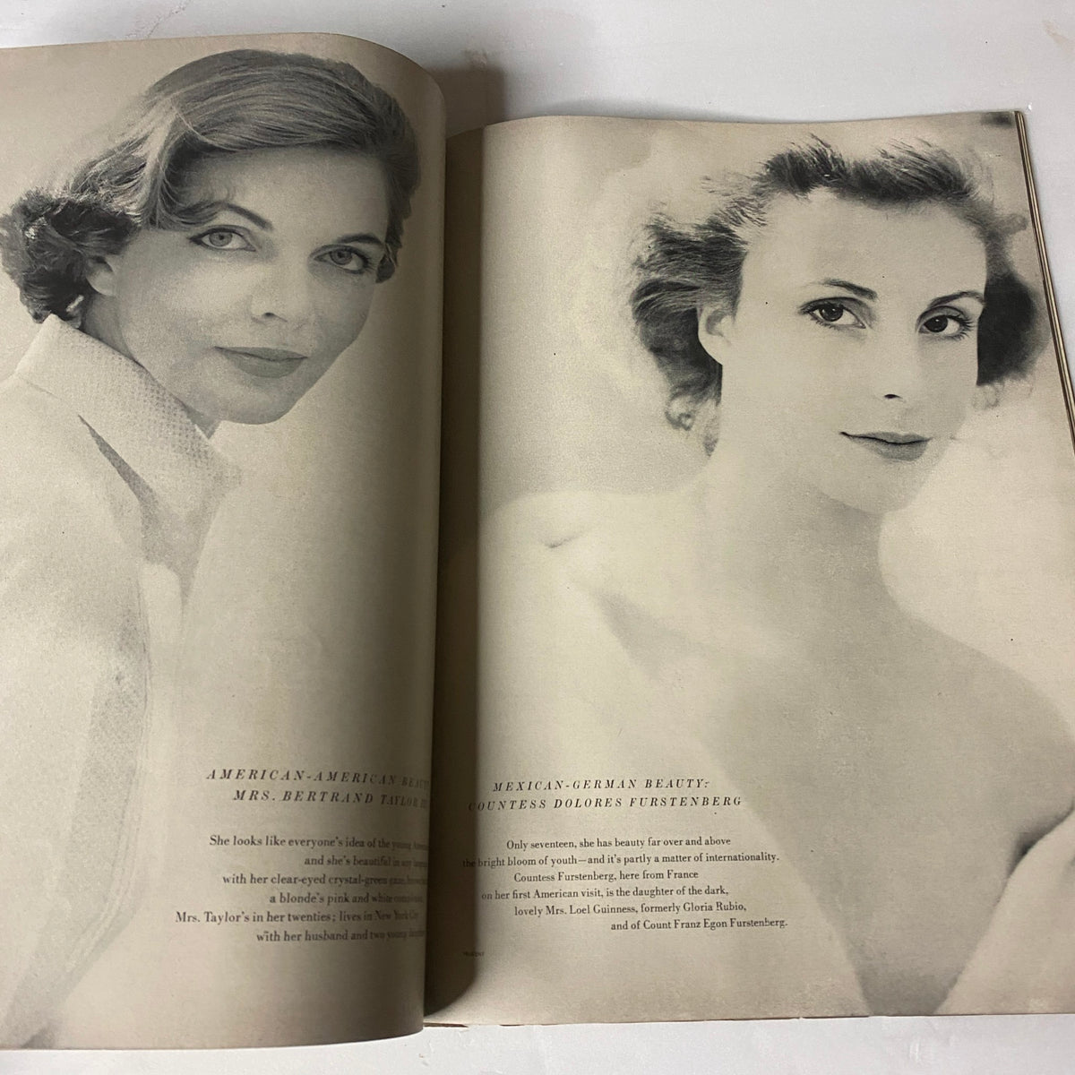 A photographic portrait of Mrs. Bertrand Taylor and Countess Dolores Furstenberg from the March 15, 1954 Vogue Magazine, highlighting classic beauty and fashion.