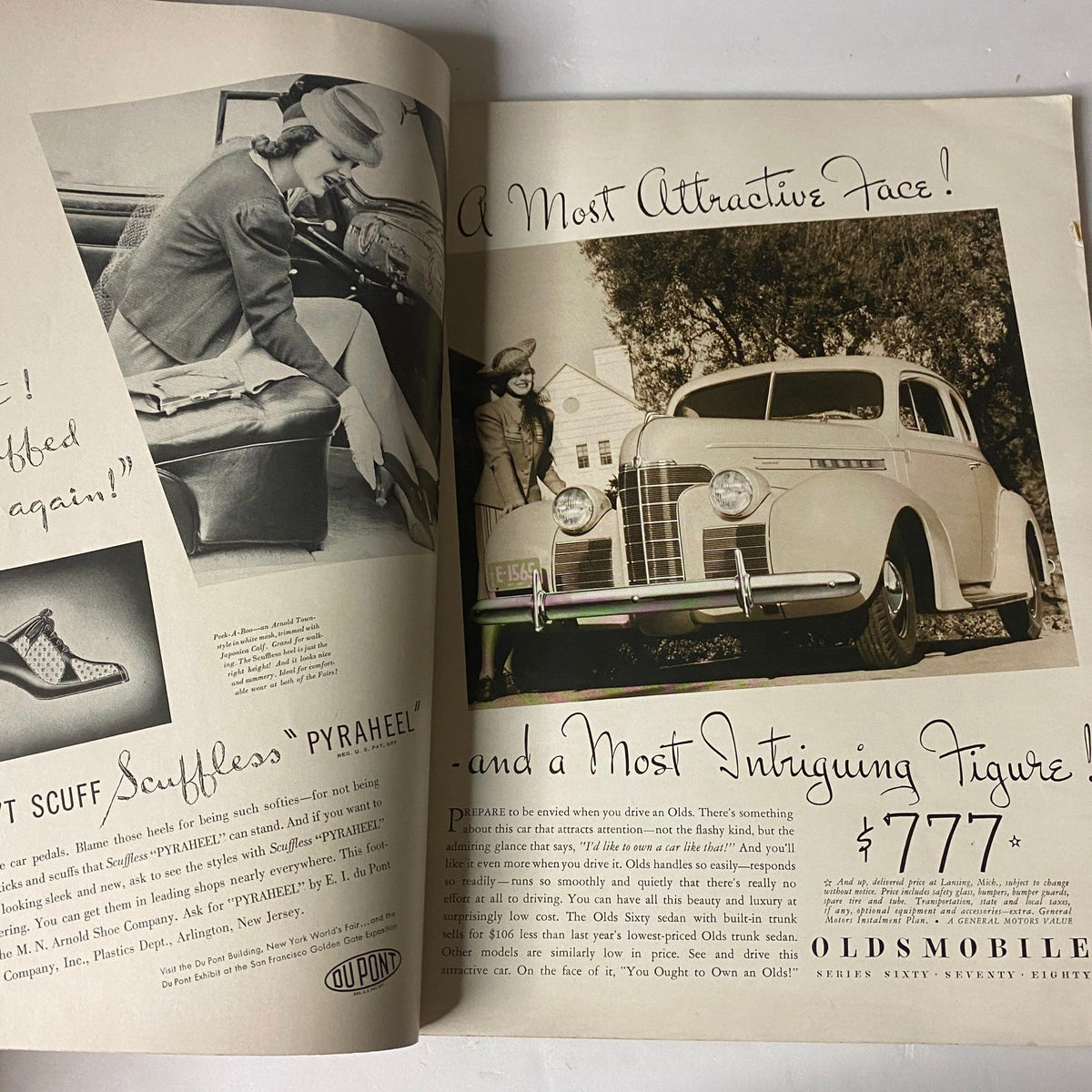 Advertisement page from Vogue Magazine April 15, 1939 featuring the Oldsmobile car along with a stylish model, reflecting 1930s luxury and design.