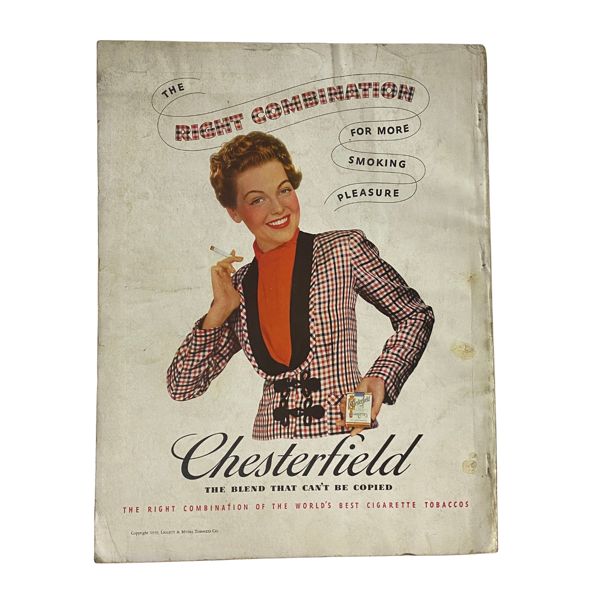 Back cover advertisement for Chesterfield cigarettes from Vogue Magazine April 15, 1939, featuring a stylish model in a checkered suit, emphasizing classic mid-century design.
