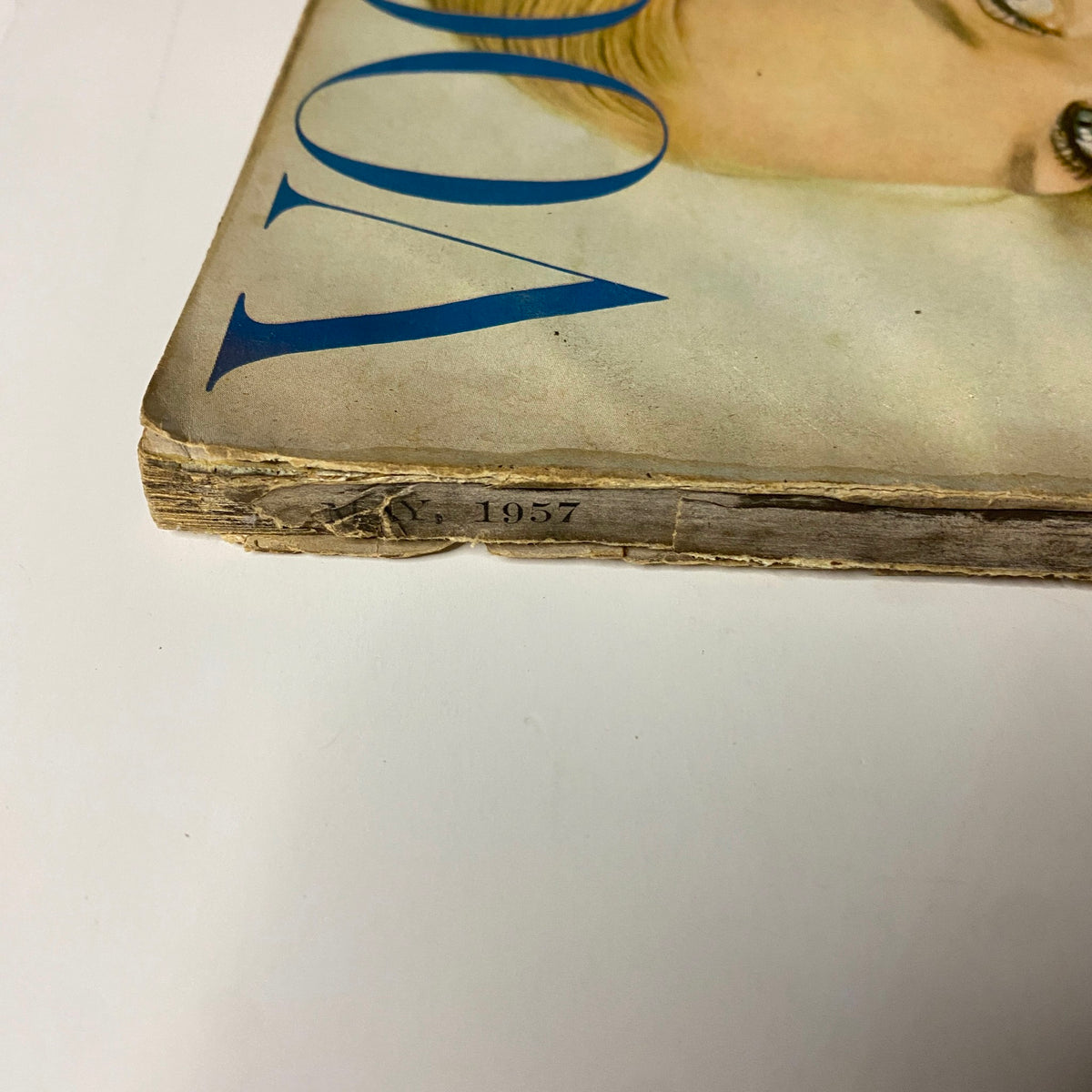 Detail view of the spine of Vogue Magazine May 1957, showing publication year 1957, featuring cover model Ann Klem.