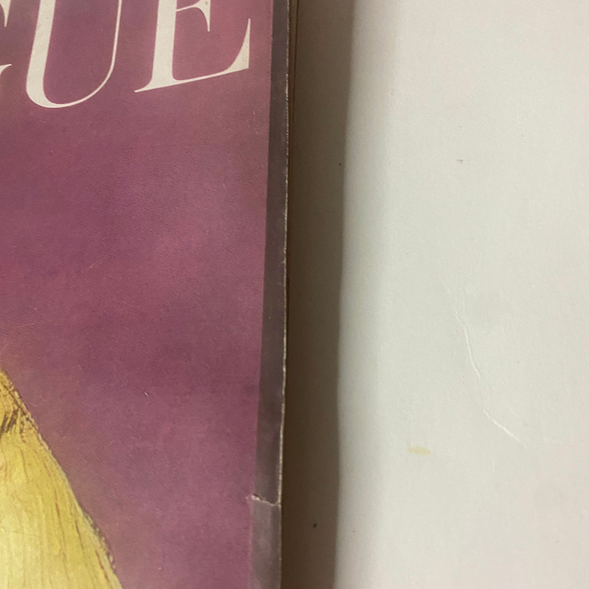 Close-up detail of the spine of Vogue Magazine October 1, 1962, showcasing vintage binding wear.