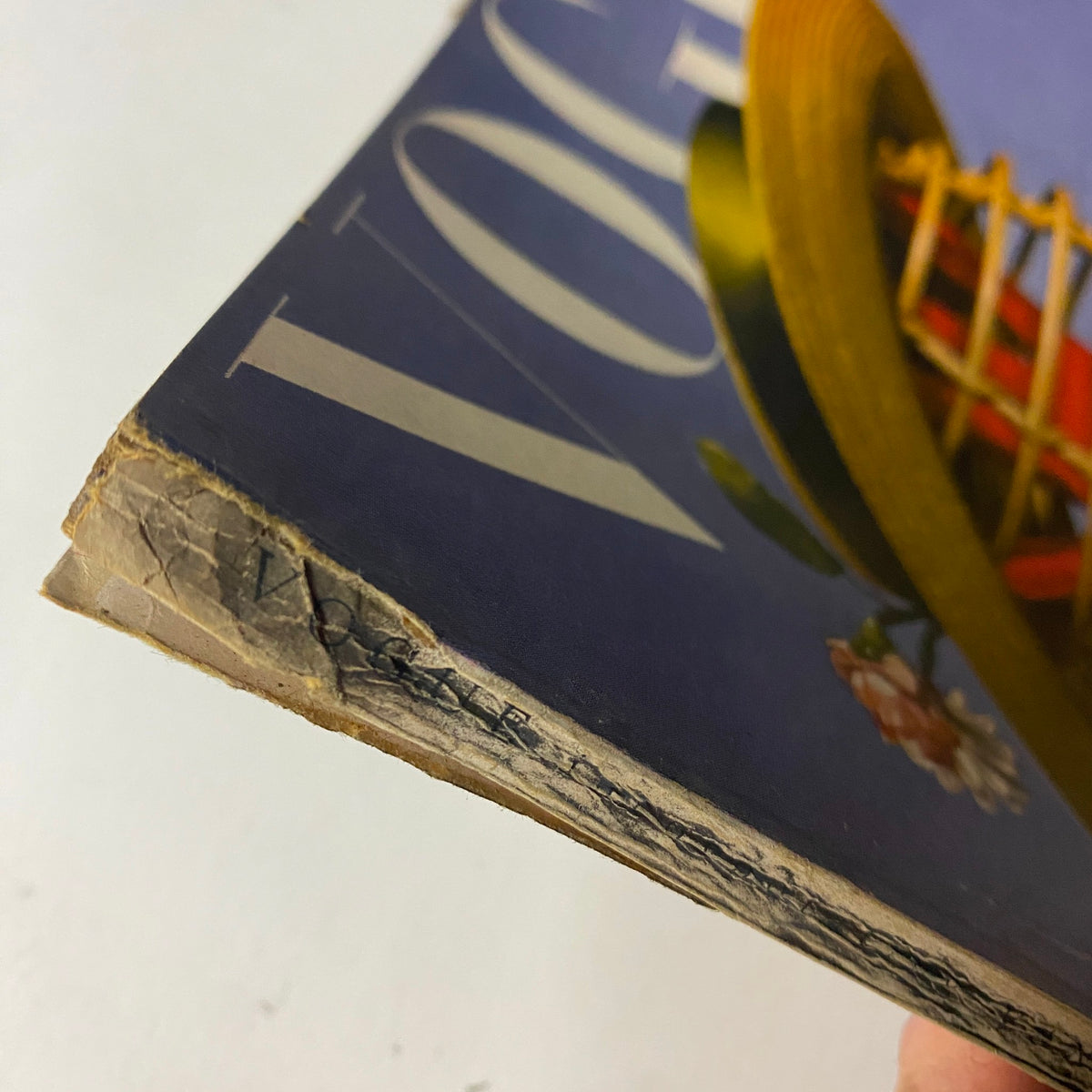 Detail of the spine of Vogue Magazine June 1944, revealing binding wear typical of vintage issues. All-Summer-Long Fashions by Haanel Cassidy.