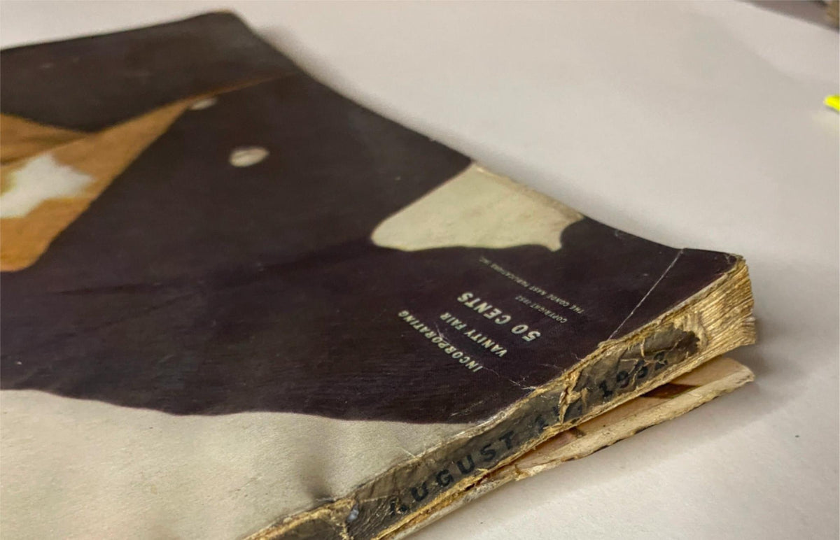 Close-up of the spine of the Vogue Magazine August 15, 1952, emphasizing the publication date and the vintage style of the College Issue.