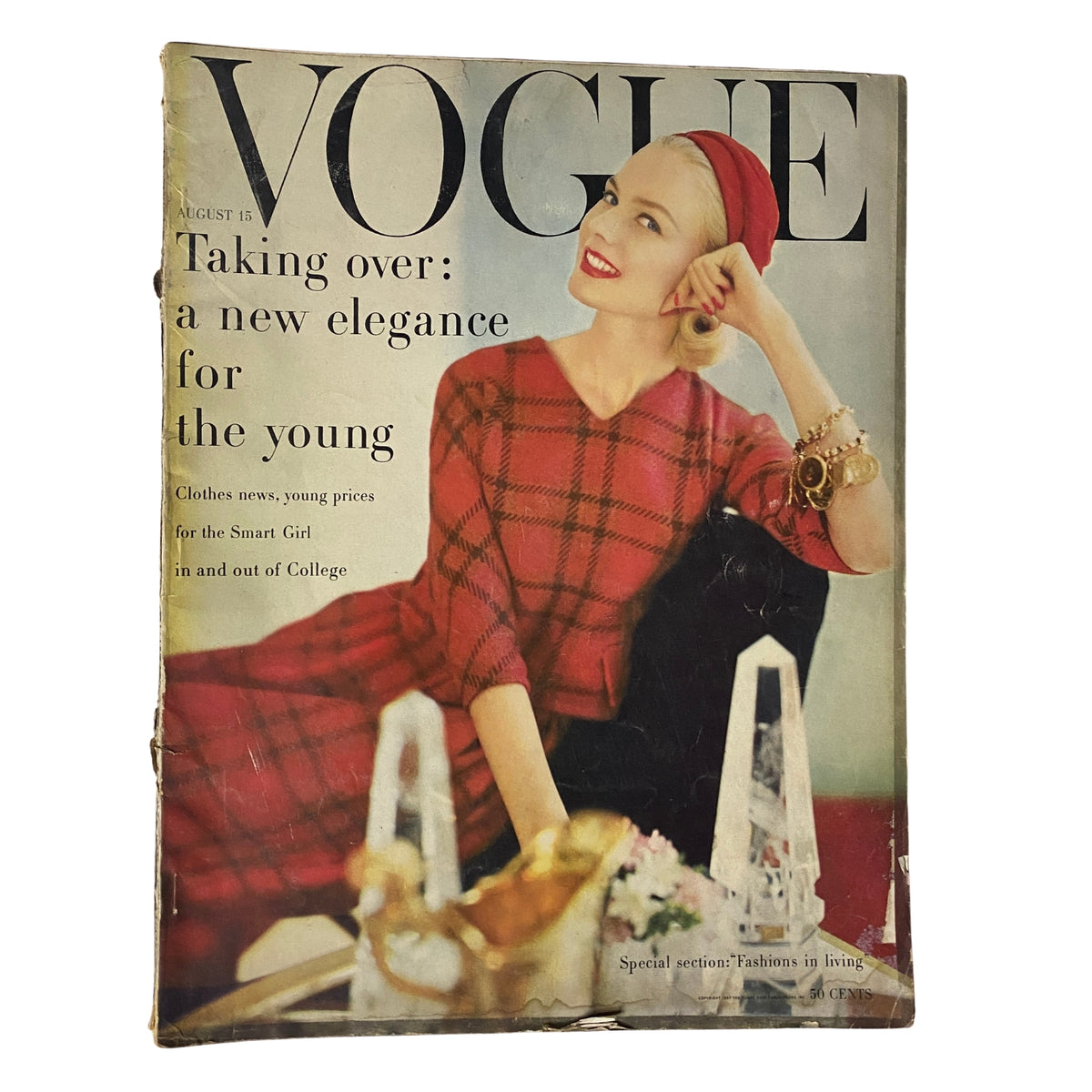 Vogue Magazine August 15, 1957 featuring Christa Vogel on the cover, showcasing a plaid ensemble and modern elegance.