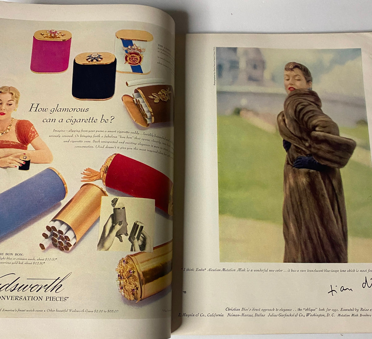 Two-page advertisement from Vogue Magazine October 15, 1950 Jean Patchett Cover by Horst P. Horst, presenting glamorous cigarette cases and a model in luxurious fur.