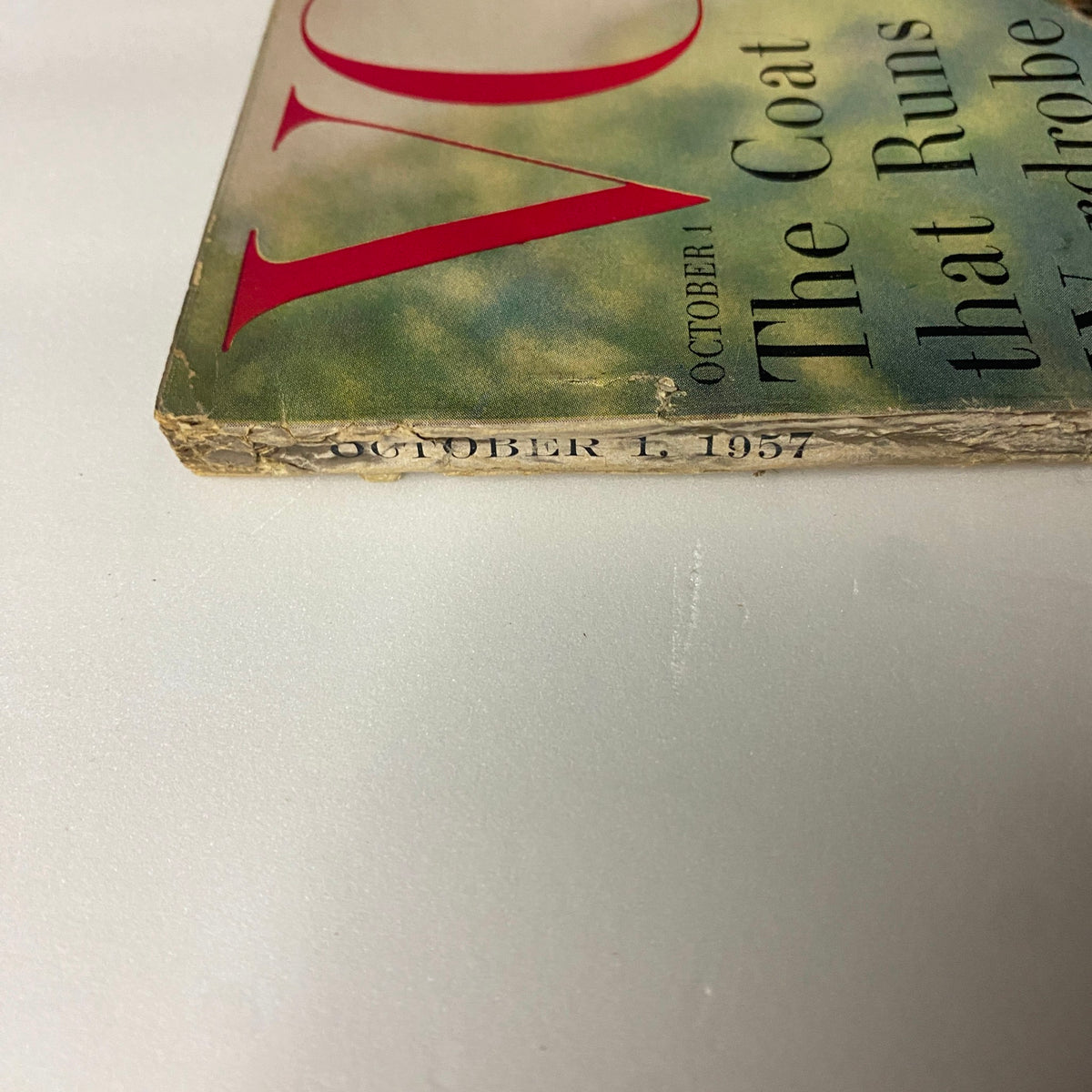 Spine view of Vogue Magazine October 1, 1957, with publication date clearly marked, displaying vintage wear.