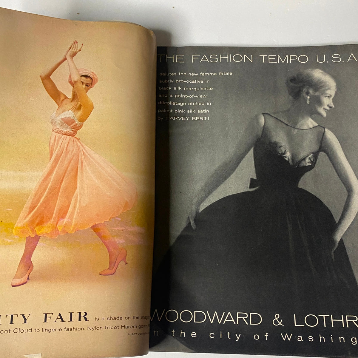 A fashion advert in Vogue Magazine December 1957 displaying elegant evening wear for women, emphasizing styles and trends in formal attire for the holiday season.