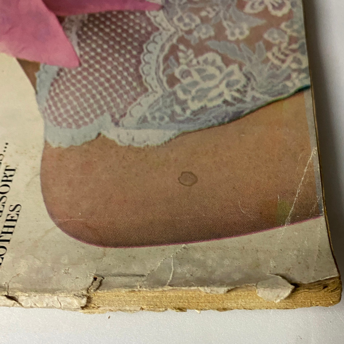 Detailed image of the cover of Vogue Magazine January 15, 1964, focusing on the lace details of the model's outfit and the magazine's age.