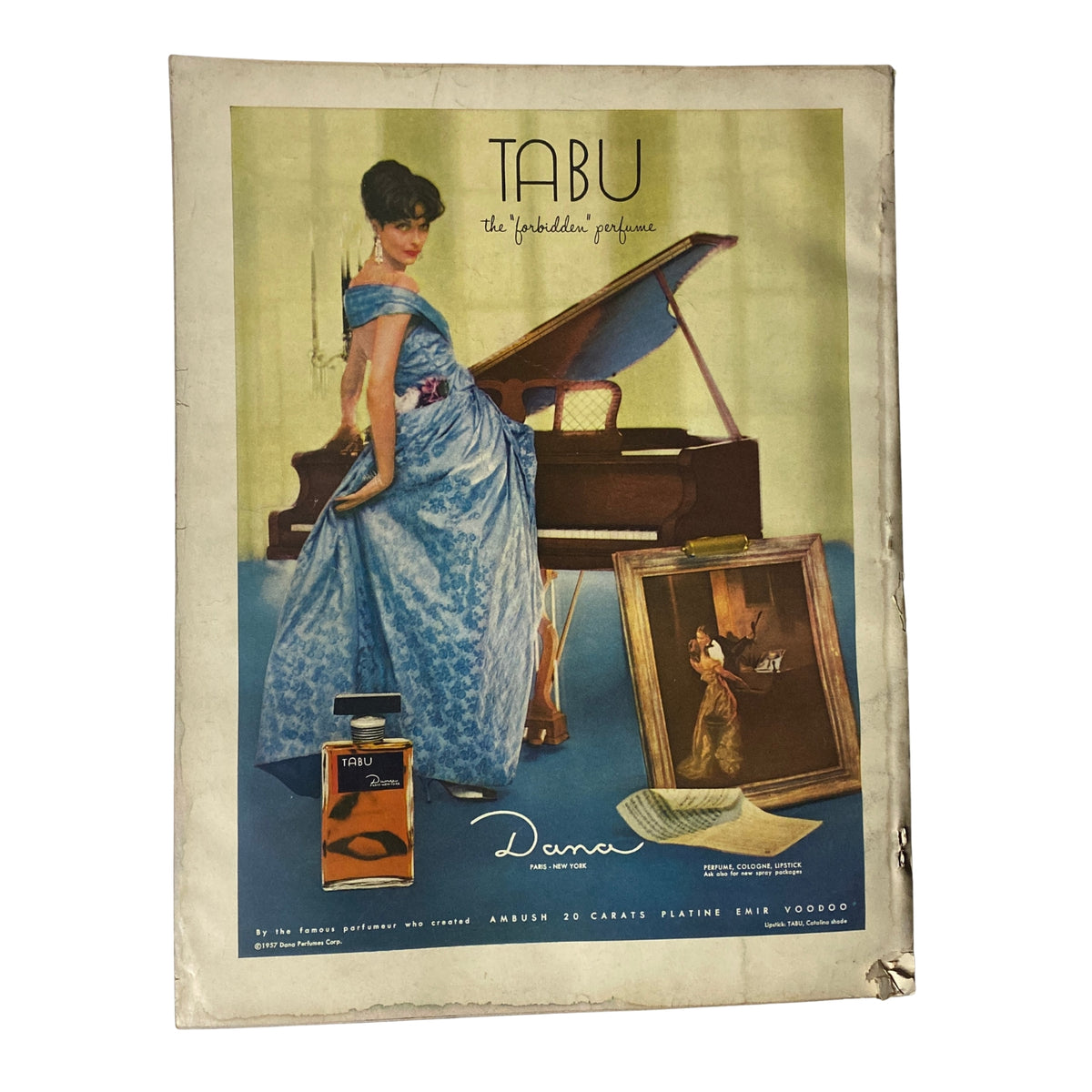 Vogue Magazine November 1, 1957 Va Taylor Cover by John Rawlings, displaying an advertisement for TABU perfume with a fashionable model.