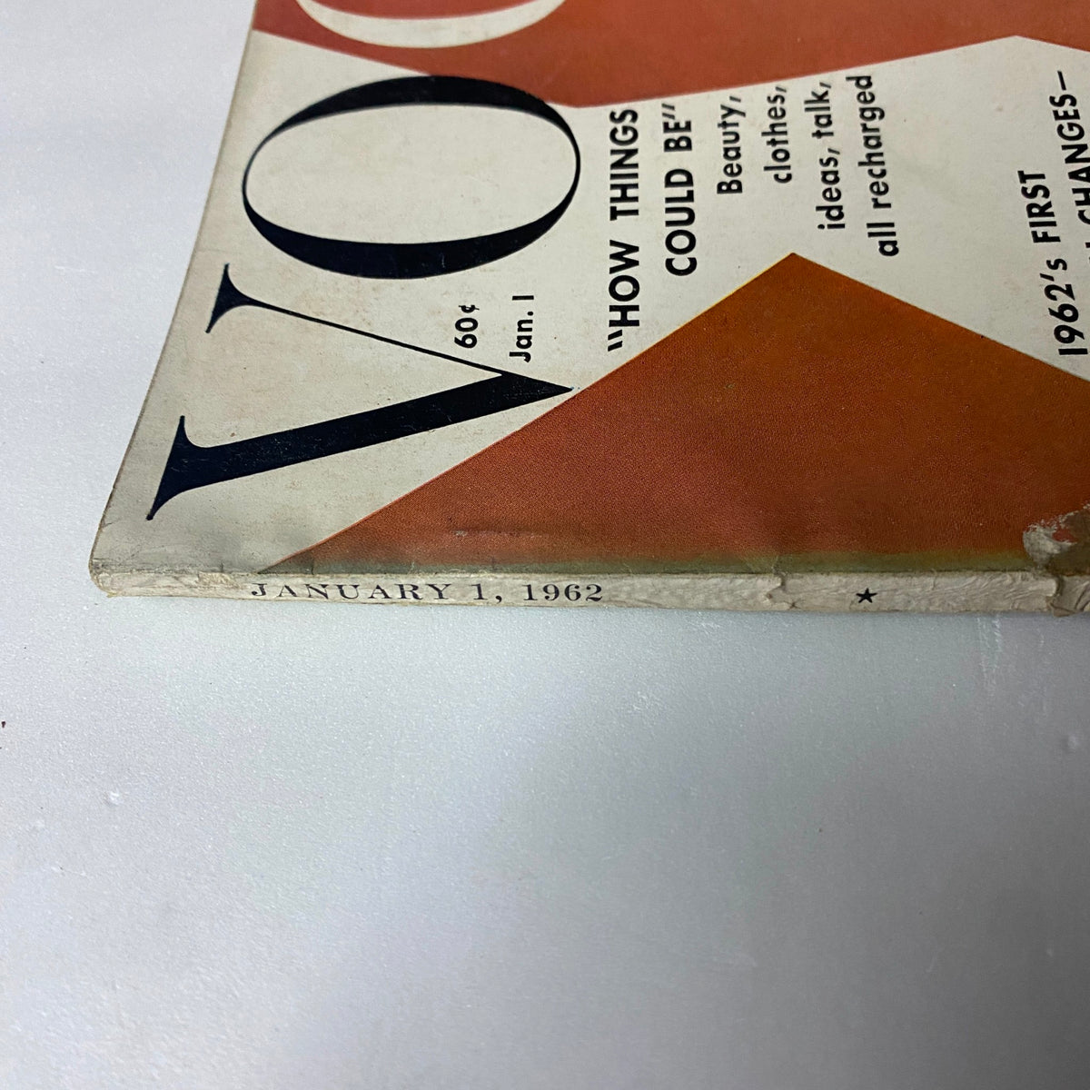 Spine corner of Vogue Magazine January 1, 1962, noting the publication date with slight wear typical of vintage magazines.