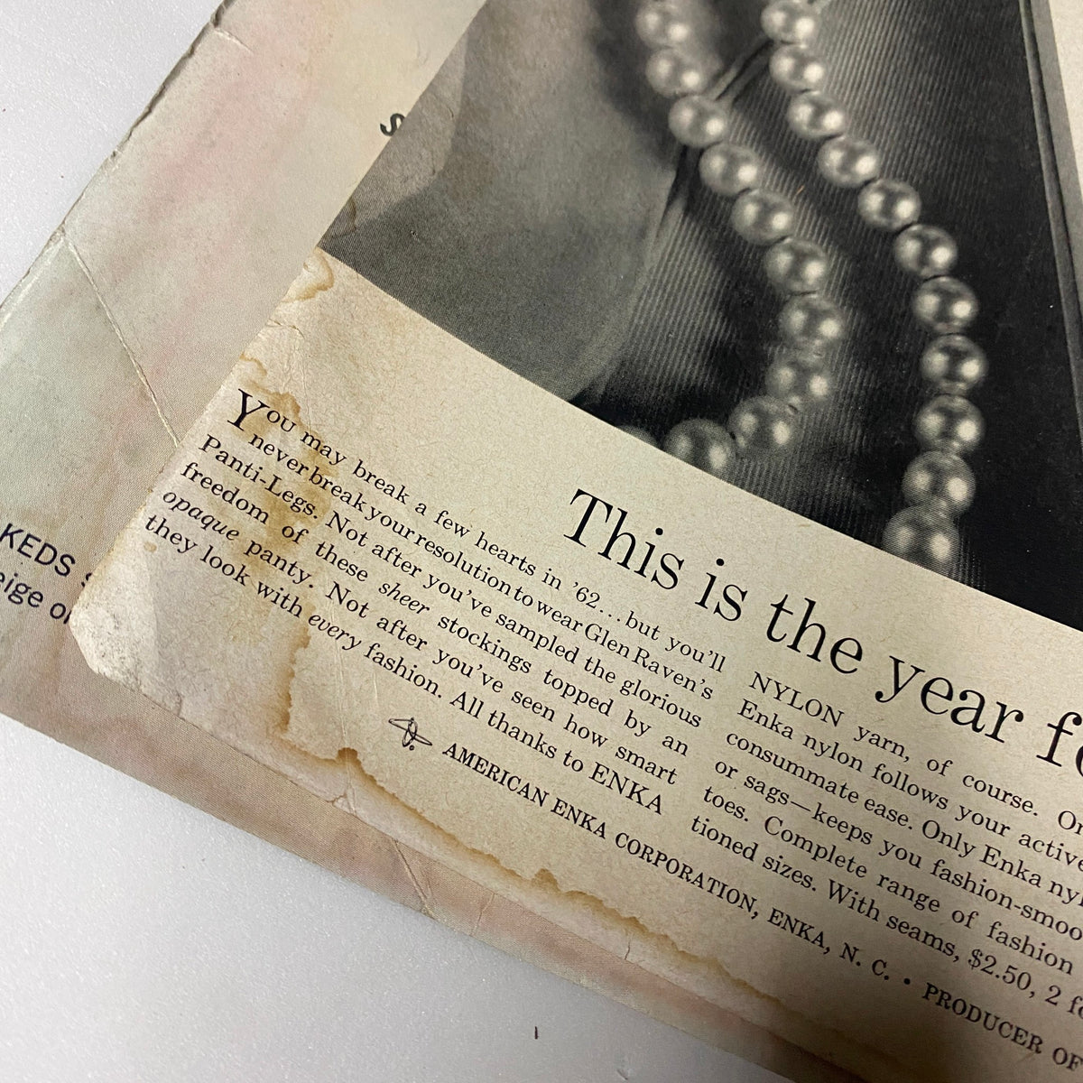 Vogue Magazine January 1, 1962 Anne De Zogheb cover by Karen Radkai, showcasing vintage fashion with a tear on the magazine's edge.
