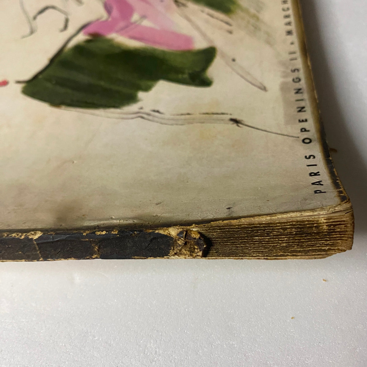 Detailed view of the bottom corner of Vogue Magazine March 15, 1938, indicating vintage wear and character, part of its history.