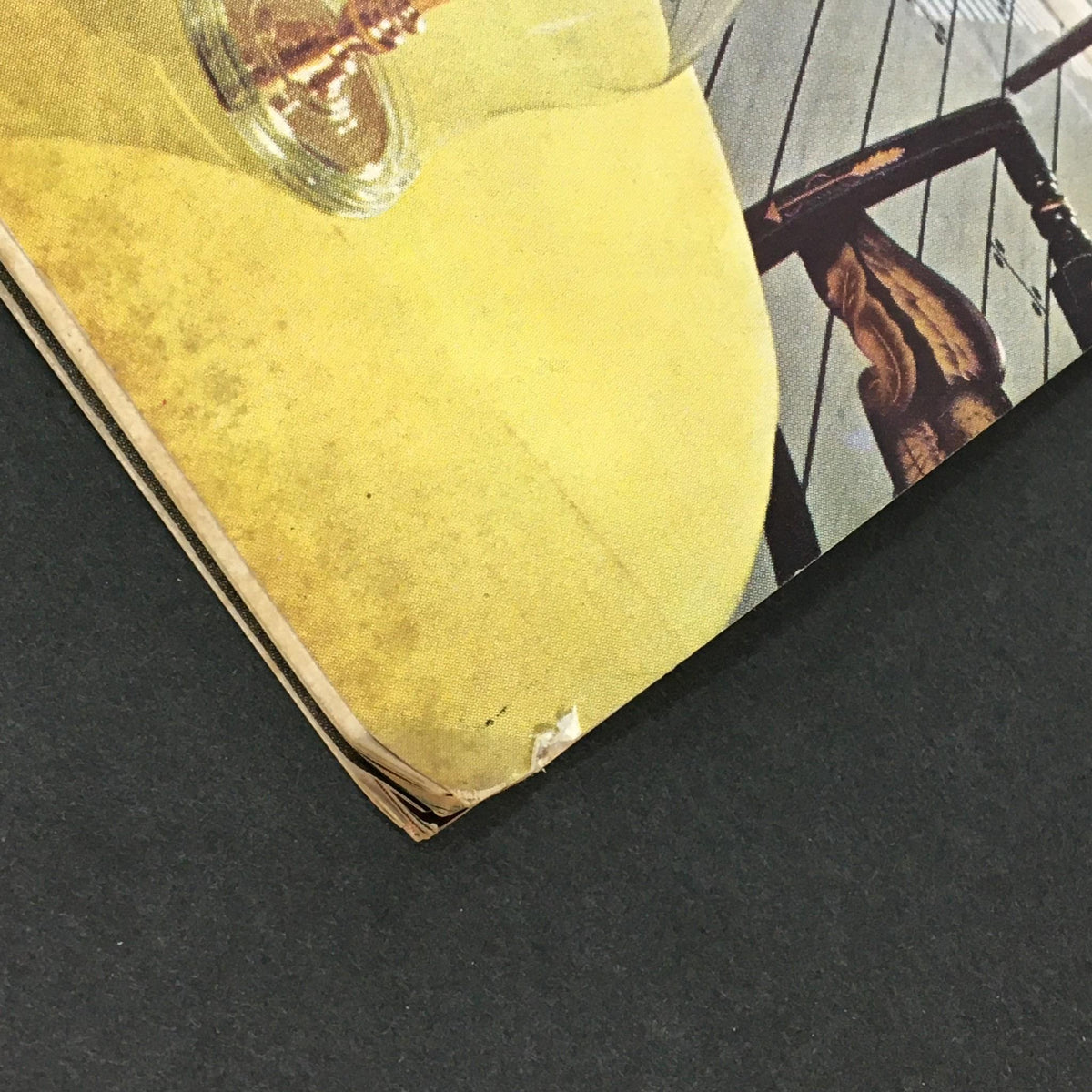 Close-up of the bottom corner of the VTG Better Homes & Gardens Magazine January 1962 Spring Planting Guide Special, showing evidence of wear and age on the magazine's spine.
