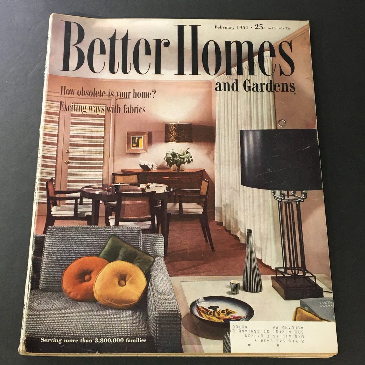 Cover of the VTG Better Homes & Gardens Magazine from February 1954, titled 'Exciting Ways With Fabrics', showcasing a stylish living room with a modern aesthetic and vibrant fabric accents.