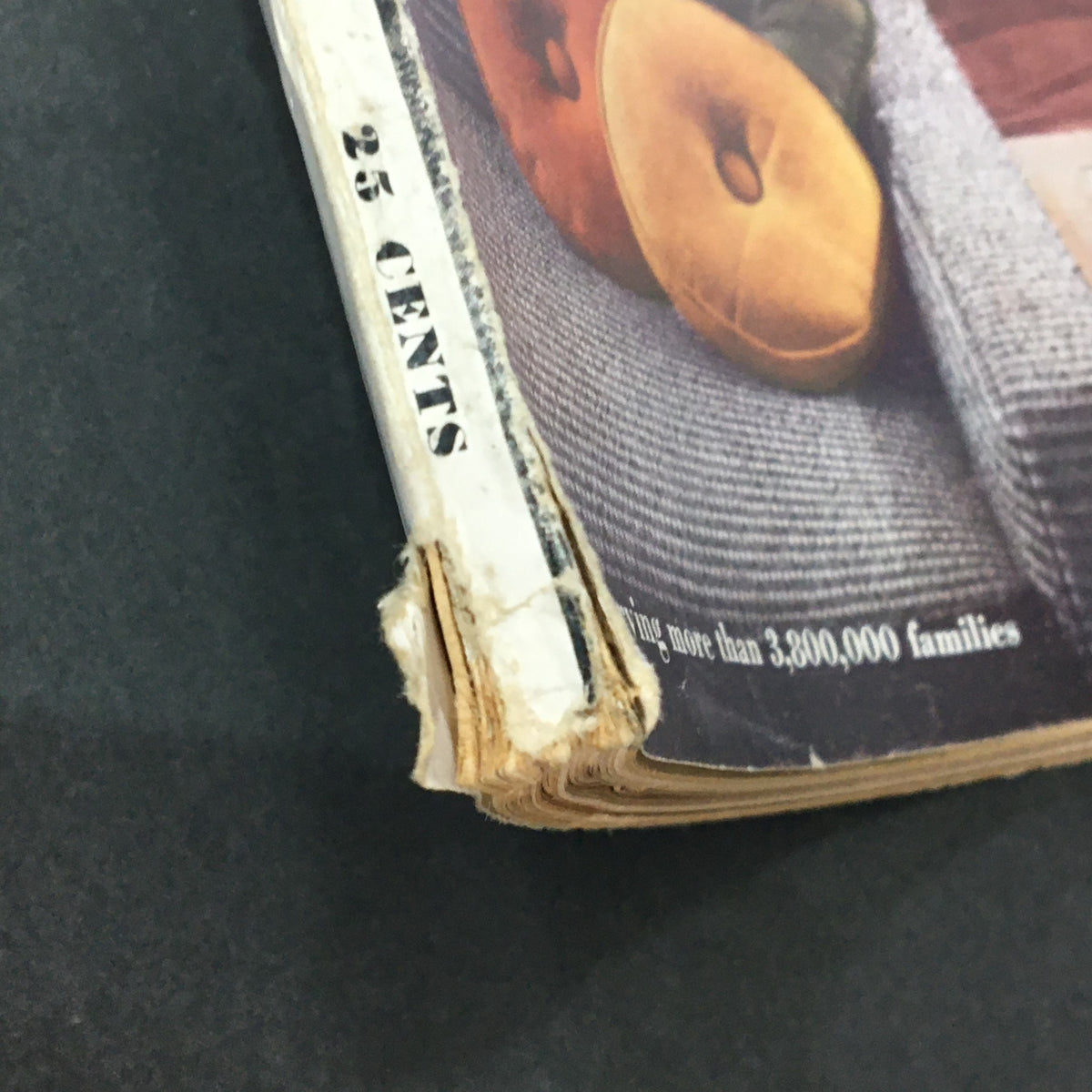 Close-up of the spine of VTG Better Homes & Gardens Magazine February 1954, highlighting its vintage price of 25 cents and signs of wear, adding character.