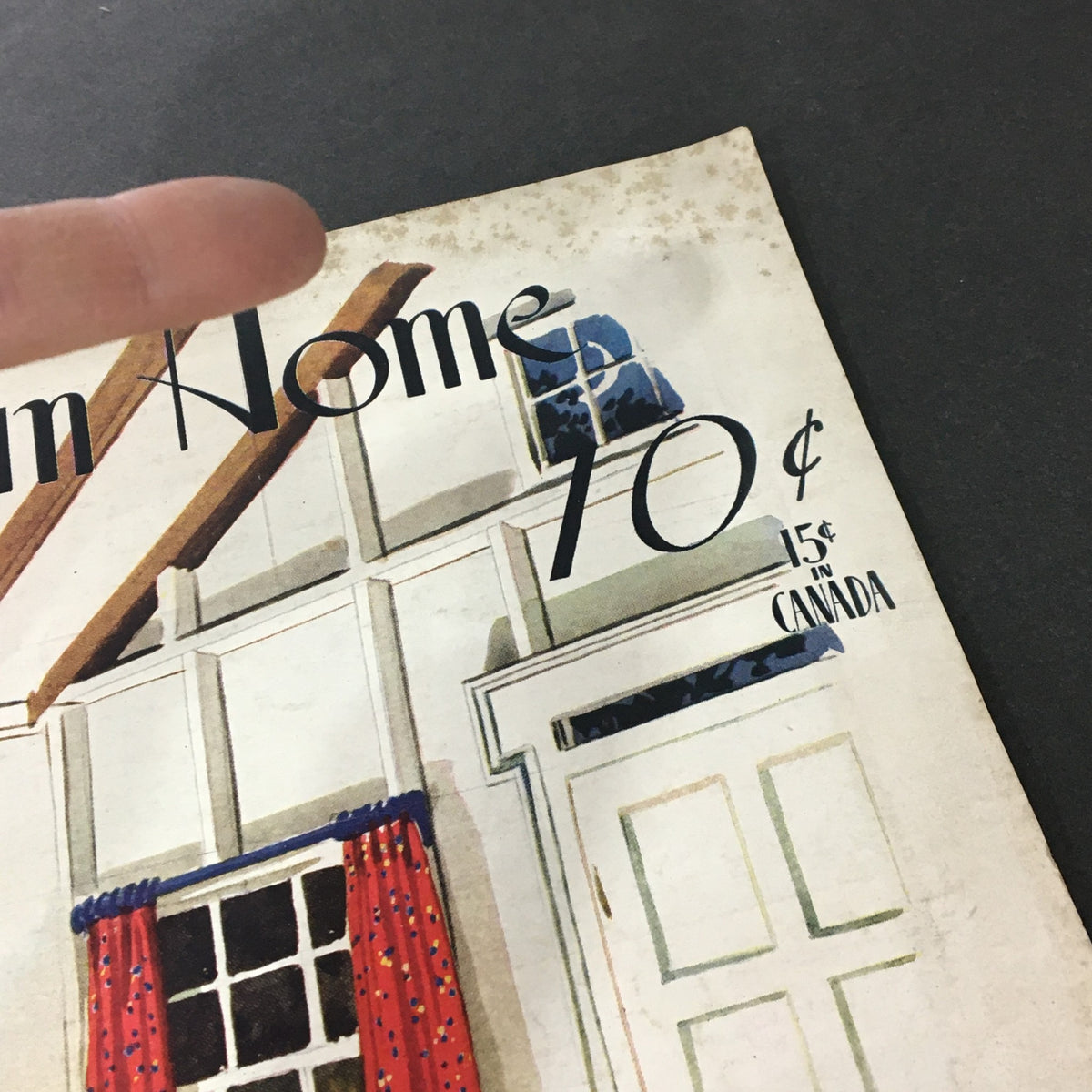 Detail of the cover of 'VTG The American Home June 1941 Graduation Day', showing the price and an illustration of traditional American home elements.