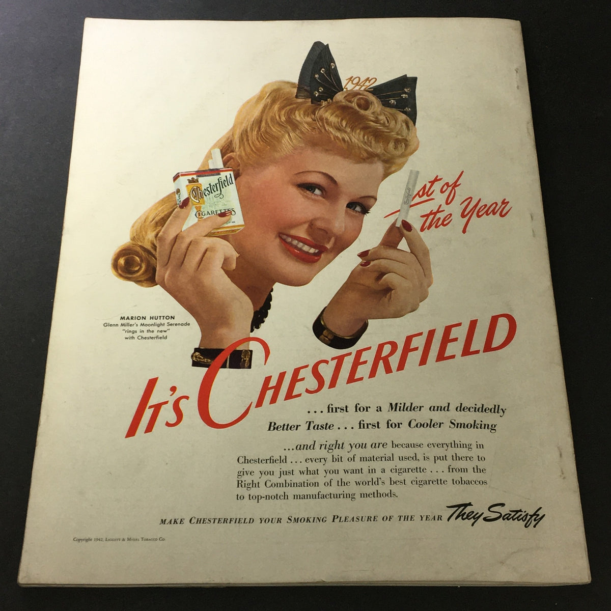 Chesterfield cigarette advertisement from VTG The American Home January 1942 magazine showcasing a glamorous woman promoting Chesterfield cigarettes with a slogan about taste.