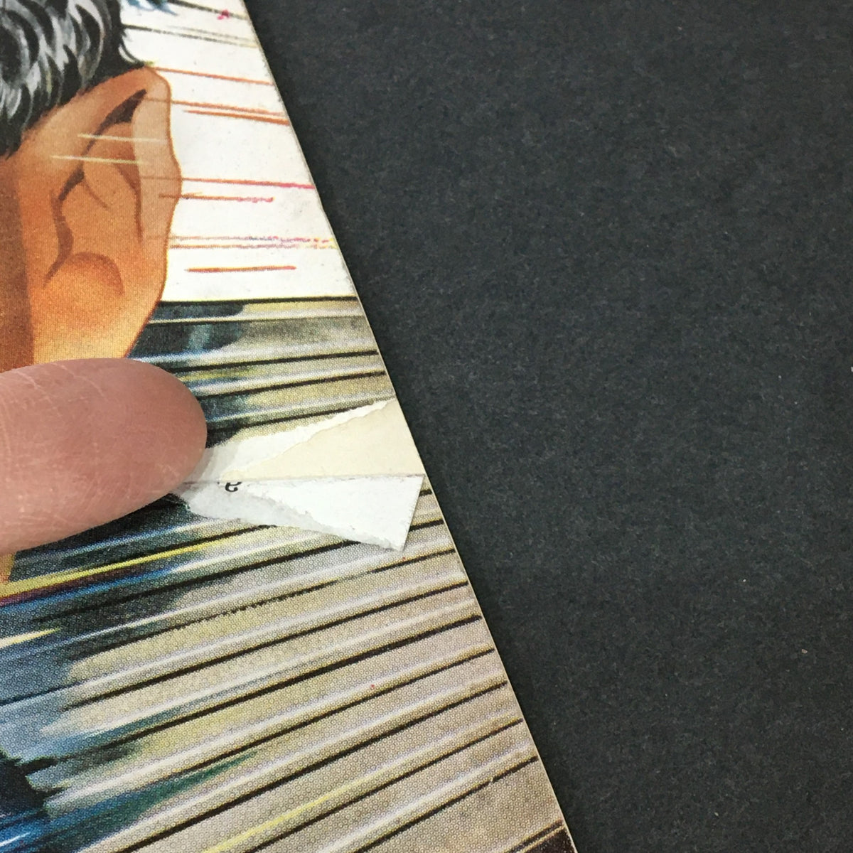 Close-up of a vintage Newsweek magazine showing the cover damage, featuring the title 'VTG Newsweek Magazine July 10 1961'.