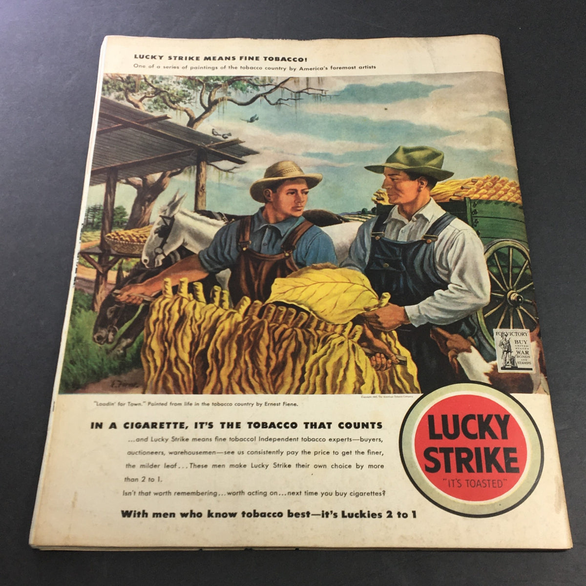 Cover of an advertisement from VTG Collier's Magazine October 10 1942 for Lucky Strike tobacco, featuring two farmers interacting in a tobacco field, embodying 1940s American agricultural culture.