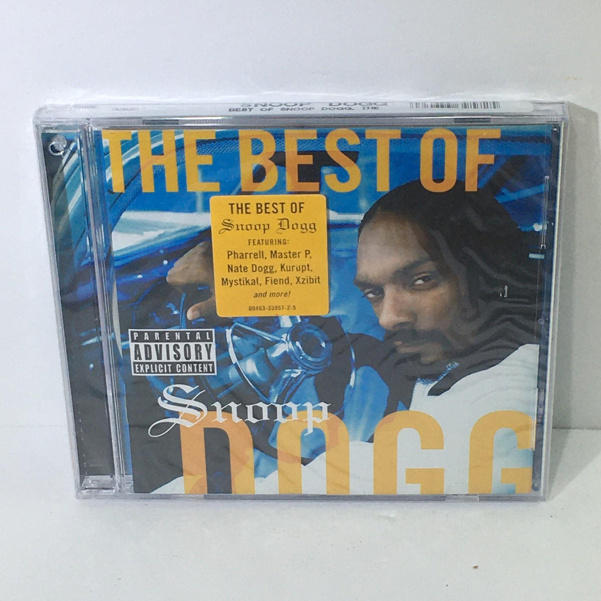 The Best of Snoop Dogg Music Audio CD with a vibrant cover featuring Snoop Dogg, highlighting tracks with Pharrell, Master P, and more, factory sealed.