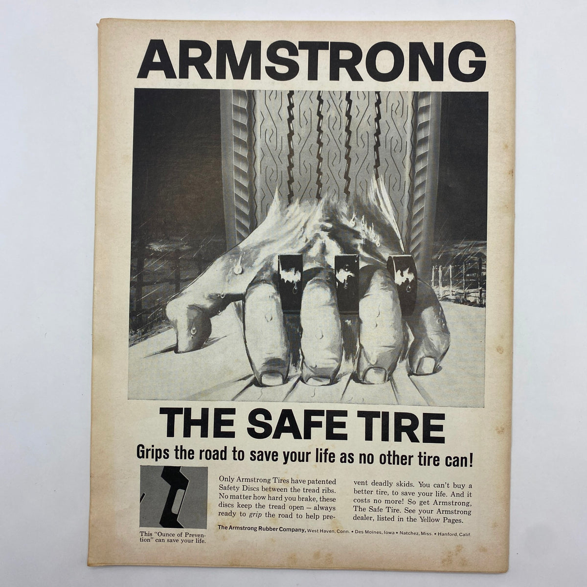Vintage advertisement for Armstrong tires, titled 'ARMSTRONG THE SAFE TIRE', showcasing a large hand gripping the road with the tagline emphasizing tire safety. This advertisement is featured in the VTG Sports Car Graphic Magazine from August 1965.