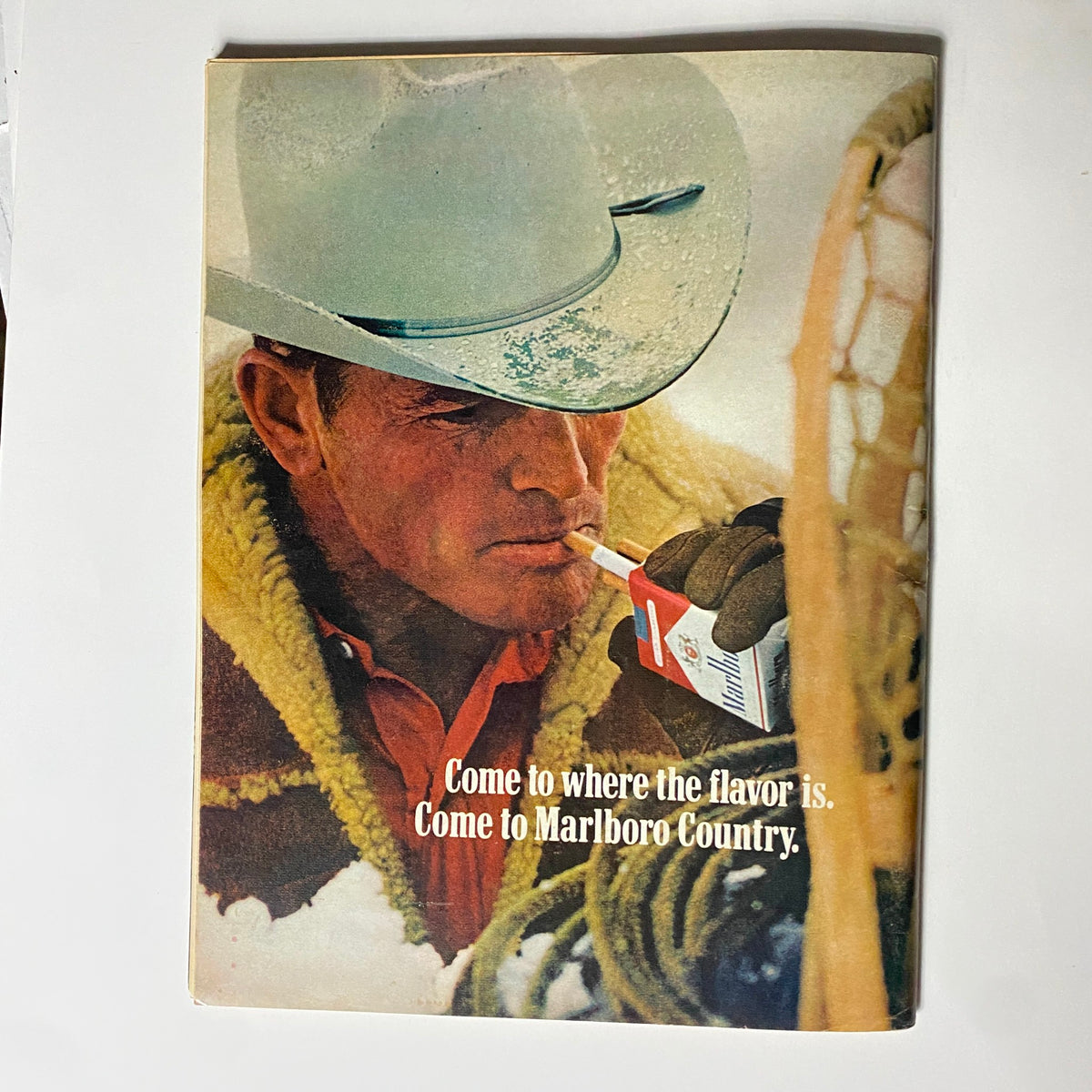 Vintage advertisement page from VTG Hot Rod Magazine February 1971 featuring a cowboy with a Marlboro cigarette, highlighting the American culture of the era.